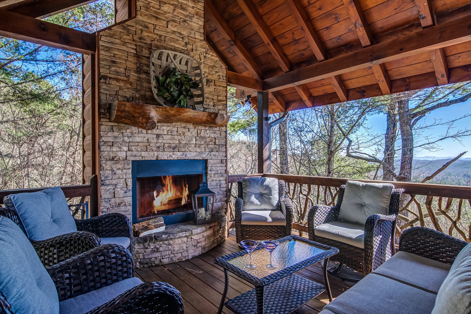Sip on your favorite night cap or indulge in a nice cup of coffee on this covered Porch with wood burning outdoor fireplace 