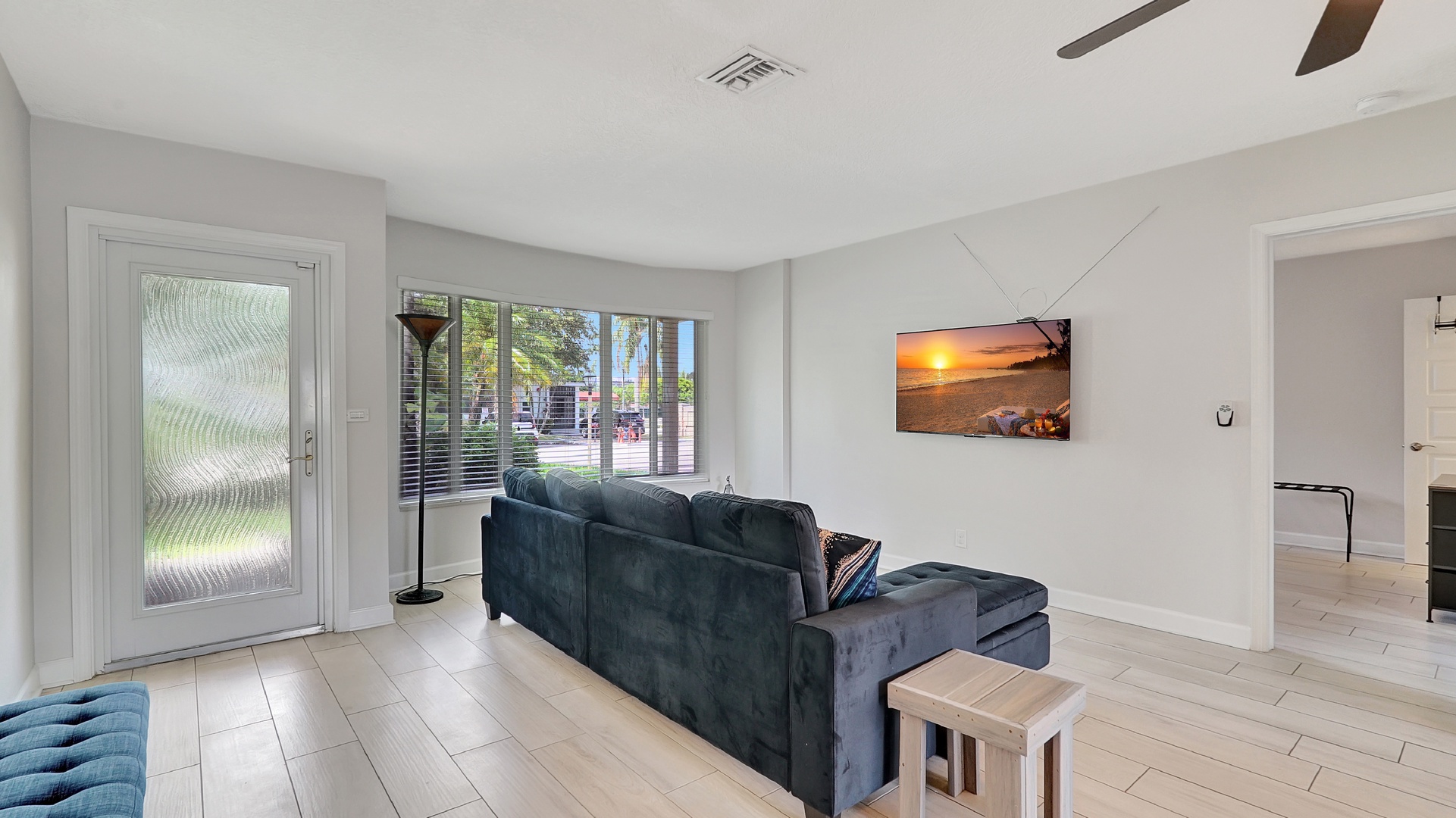 Bright living room with Smart TV, and cozy seating