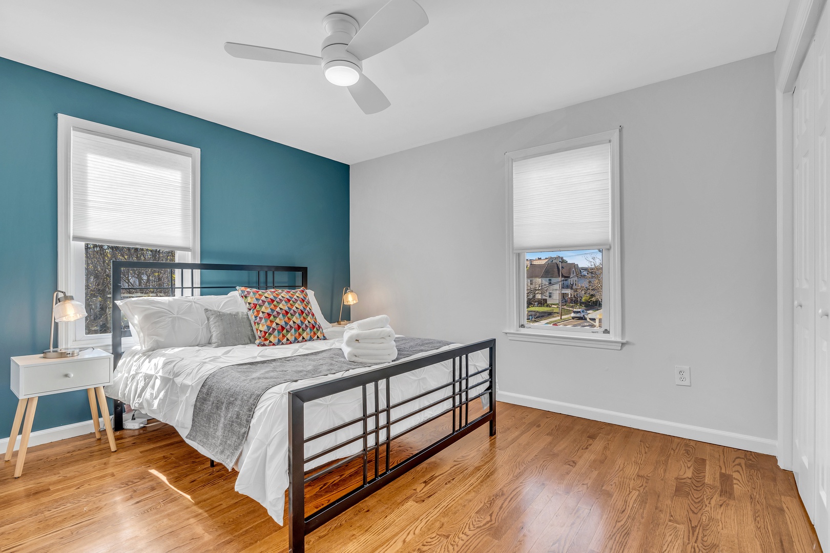 This serene 2nd floor bedroom showcases a plush queen-sized bed