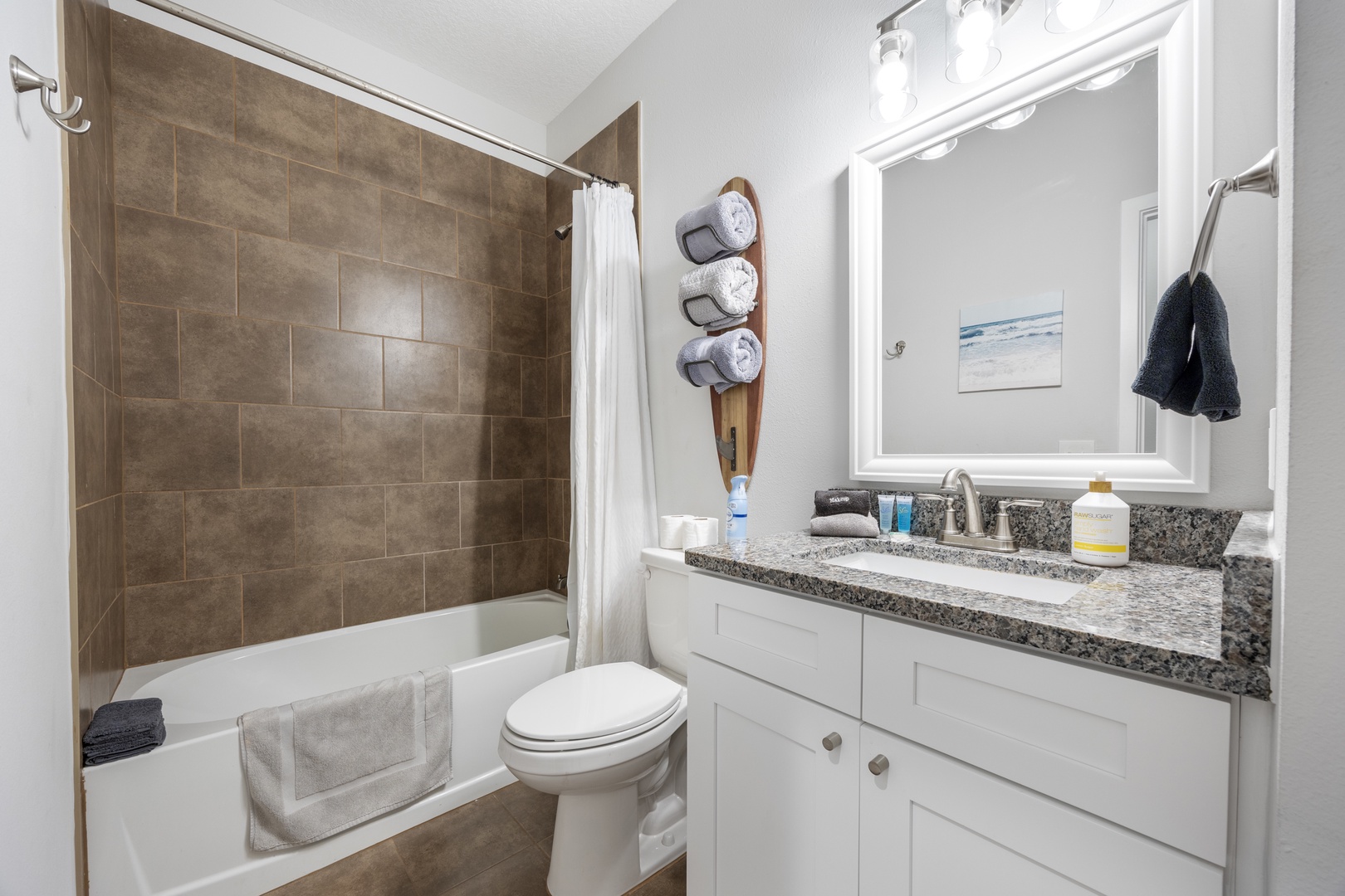 The shared full bathroom includes a single vanity & shower/tub combo