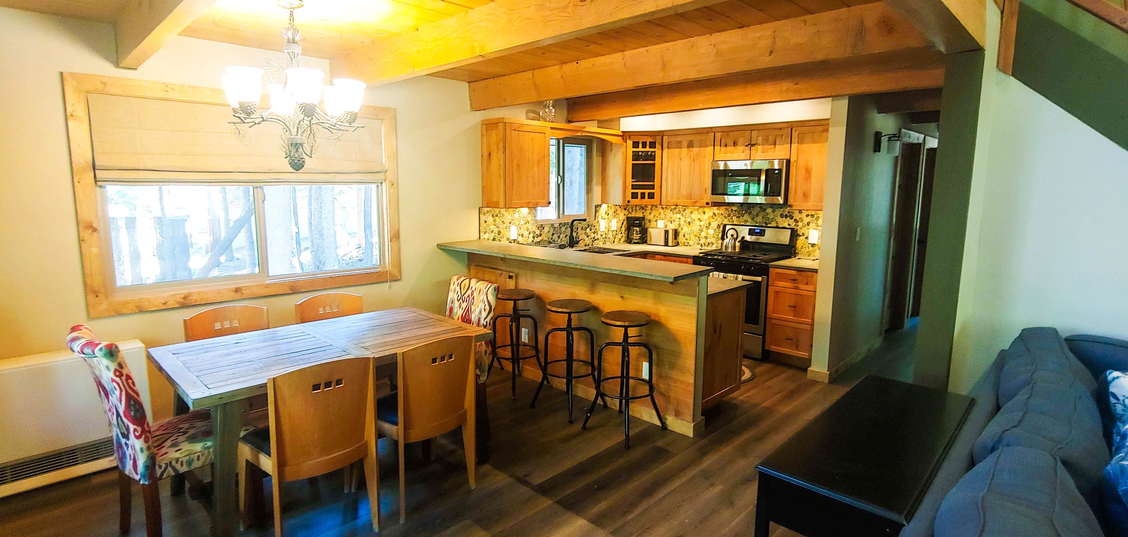 Fully equipped kitchen with additional barstool seating for 4