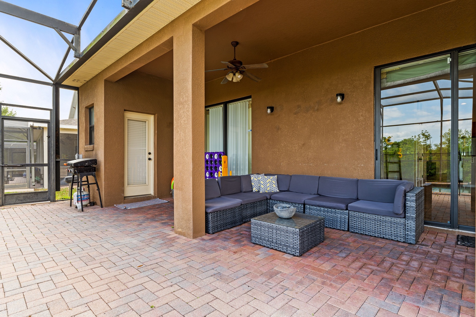 Private screened pool with outdoor seating, games & ceiling fans