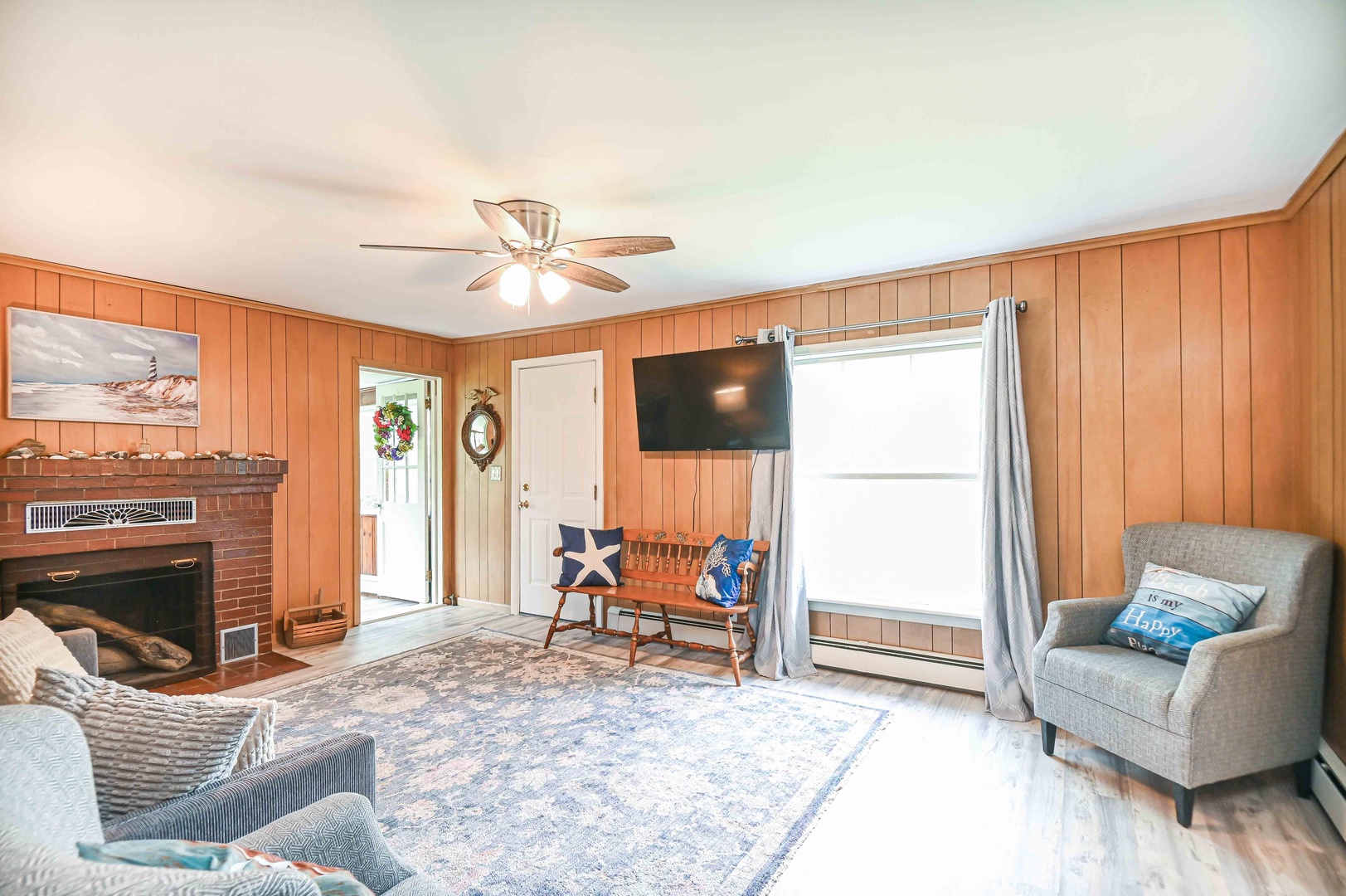 Living room with Smart TV and full size sofa sleeper