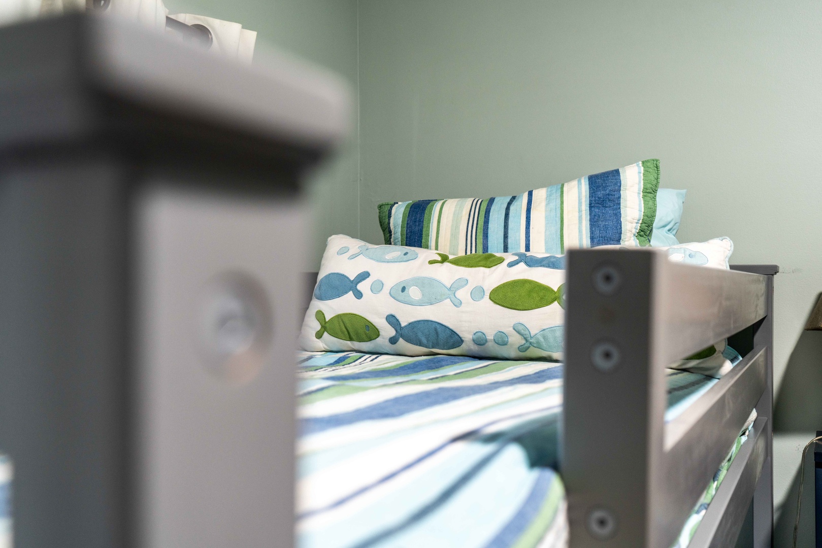 A pair of cozy twin-over-twin bunkbeds awaits in the final bedroom