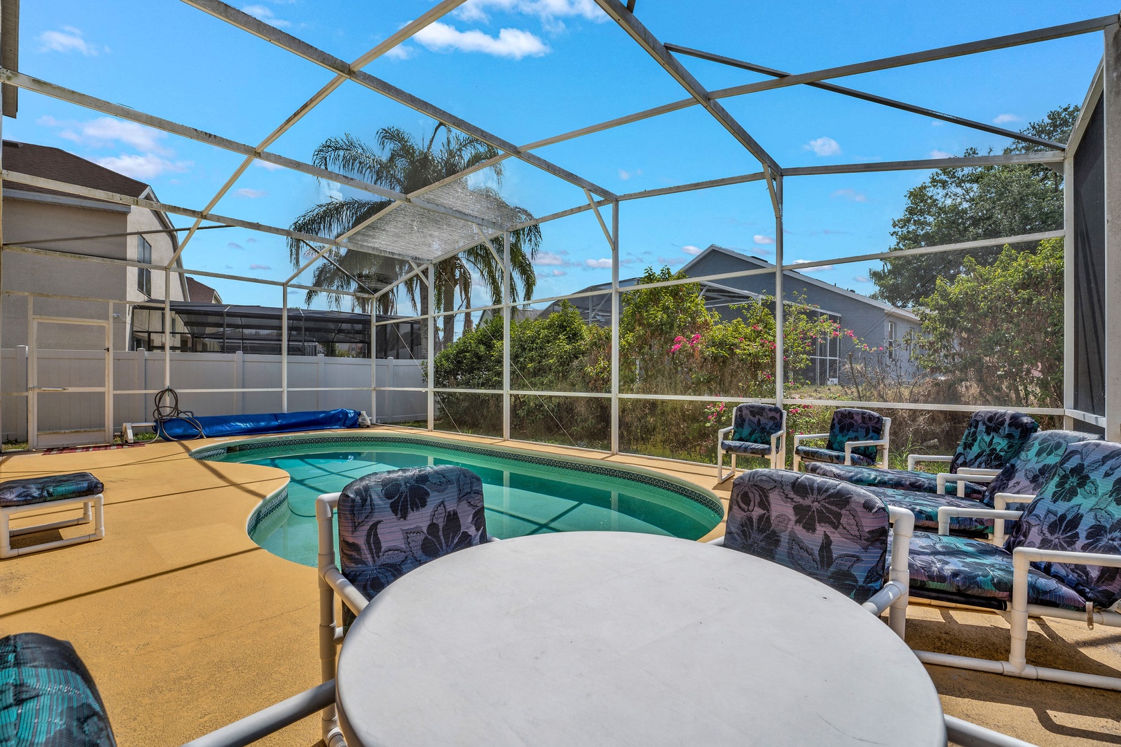 Private screened pool with outdoor seating