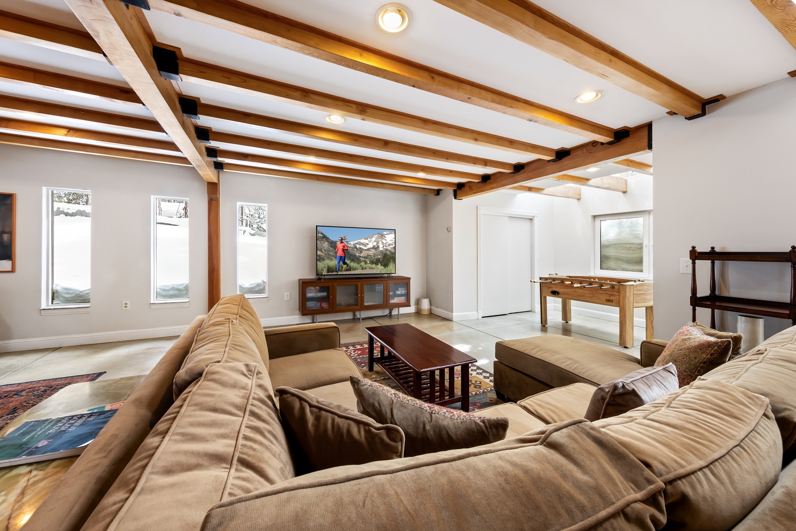 Cozy and spacious living area with TV