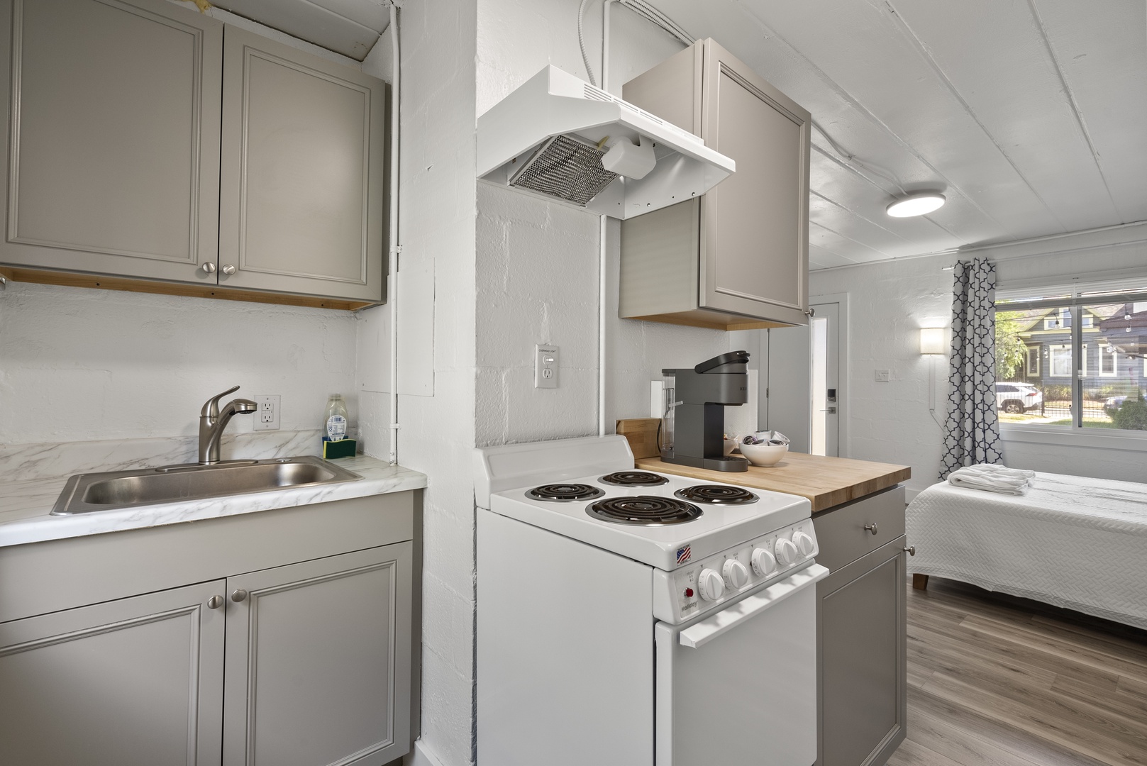 The chic kitchen provides plenty of storage and all the comforts of home