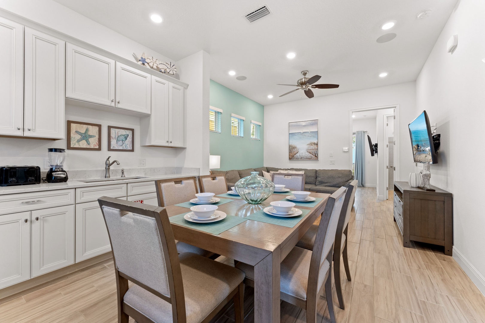 The beachy eat-in kitchen offers ample space & all the comforts of home