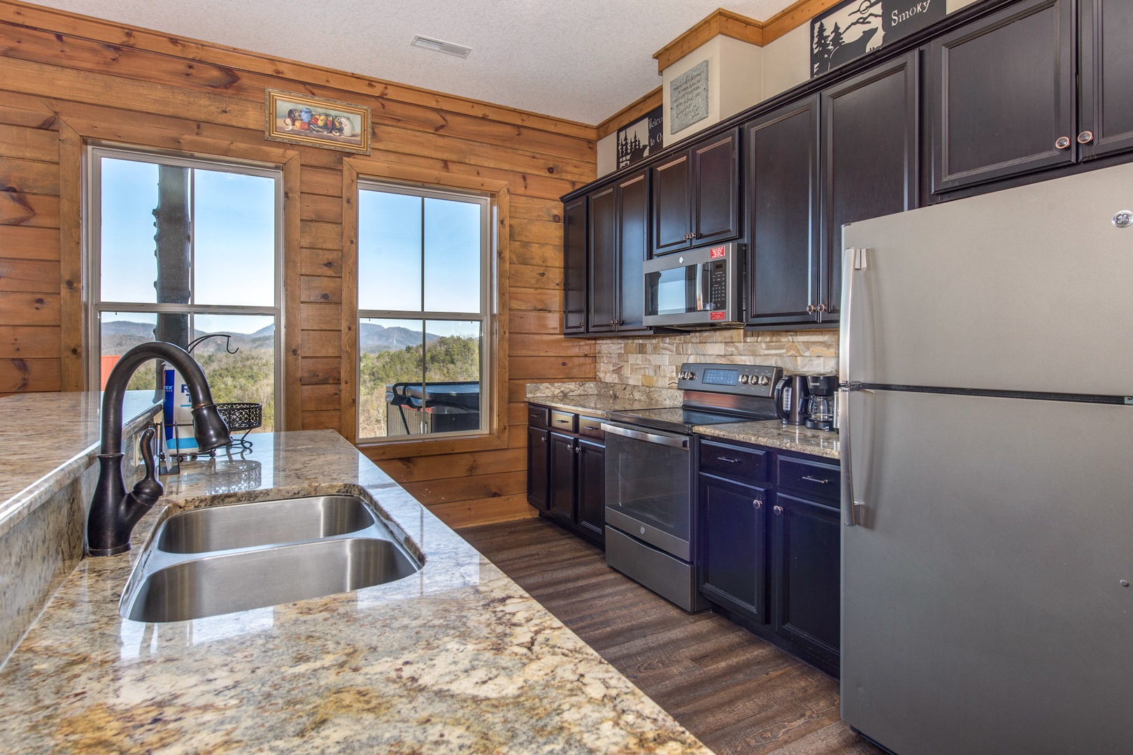 The spacious kitchen provides ample room and all the comforts of home.