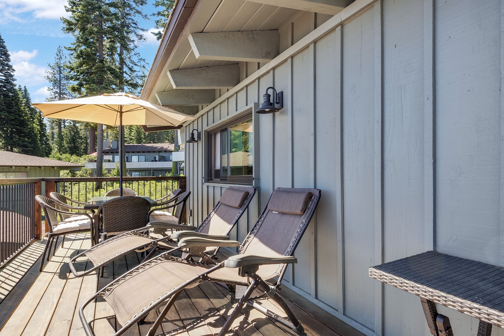 Lounge chairs and outdoor dining in the balcony