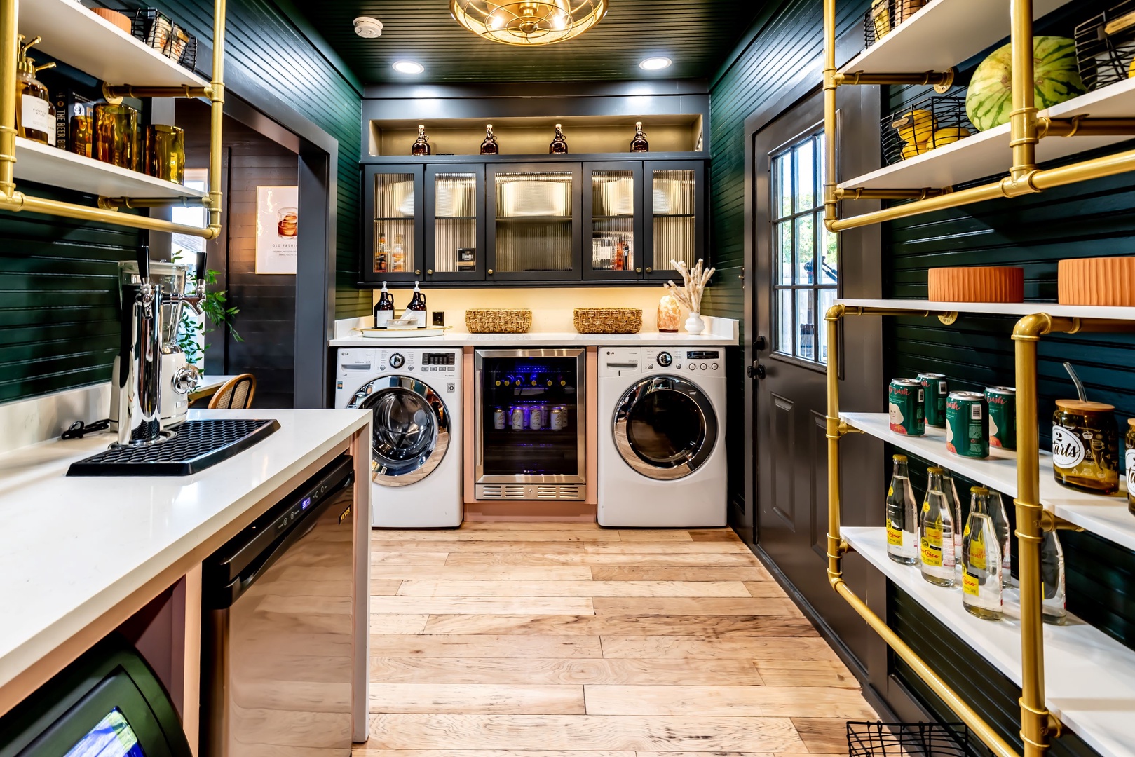Private laundry is neatly tucked away in the pantry area