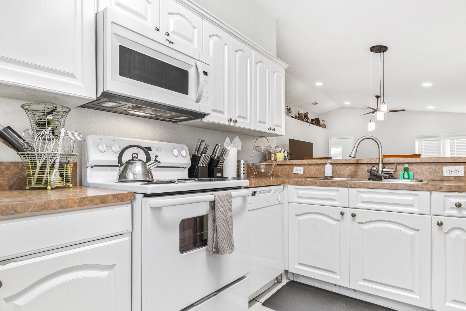 The open, airy kitchen offers ample space & all the comforts of home