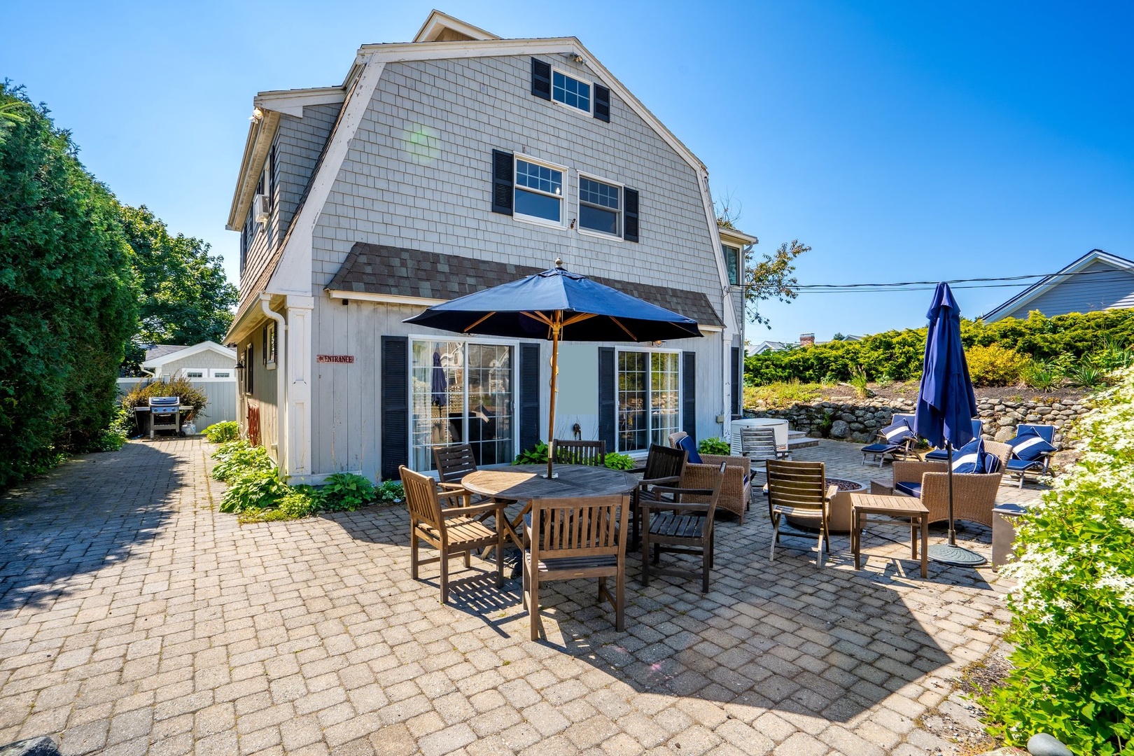 Inviting front patio with cozy fire pit for relaxation