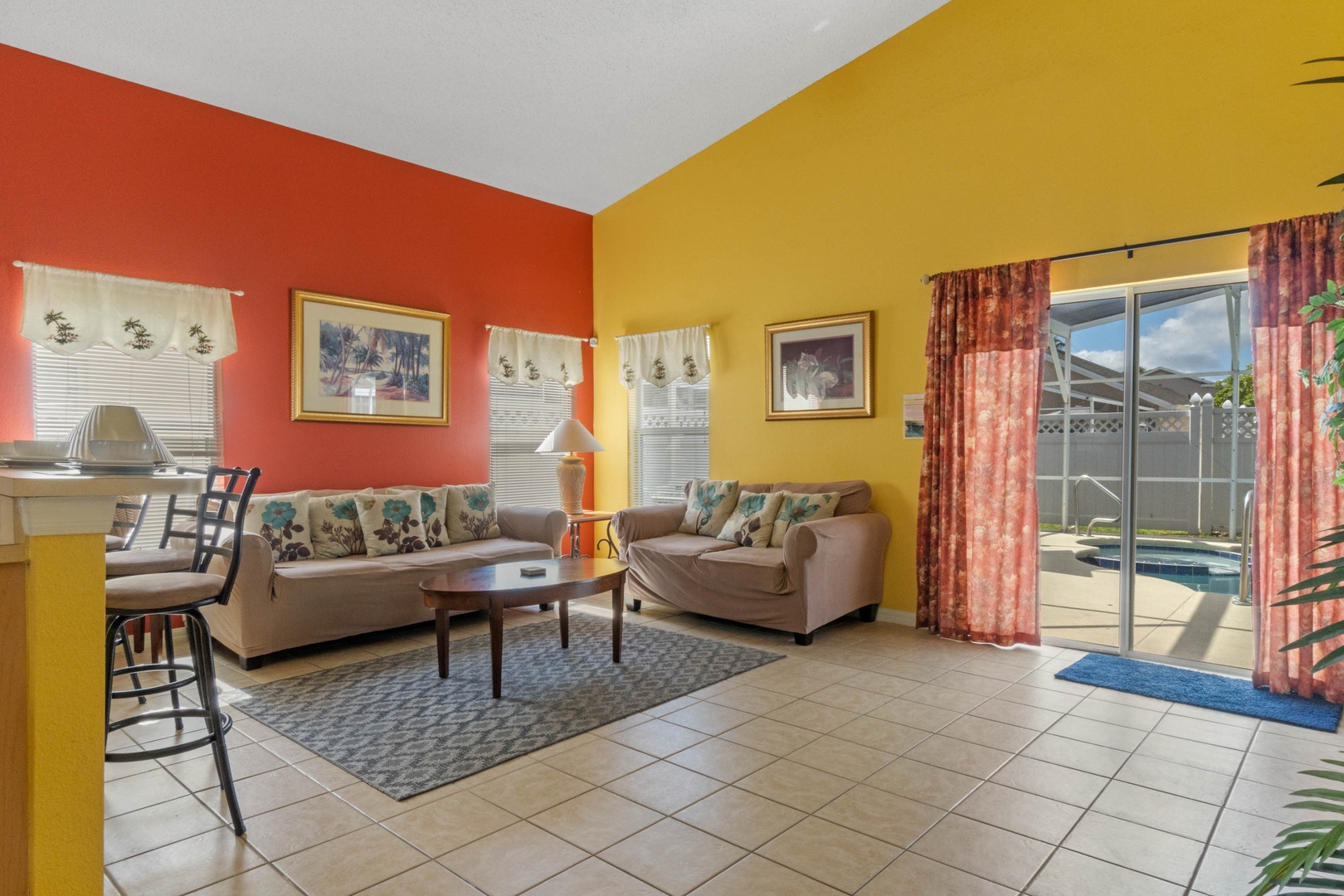Living room features SmartTV & access to pool deck