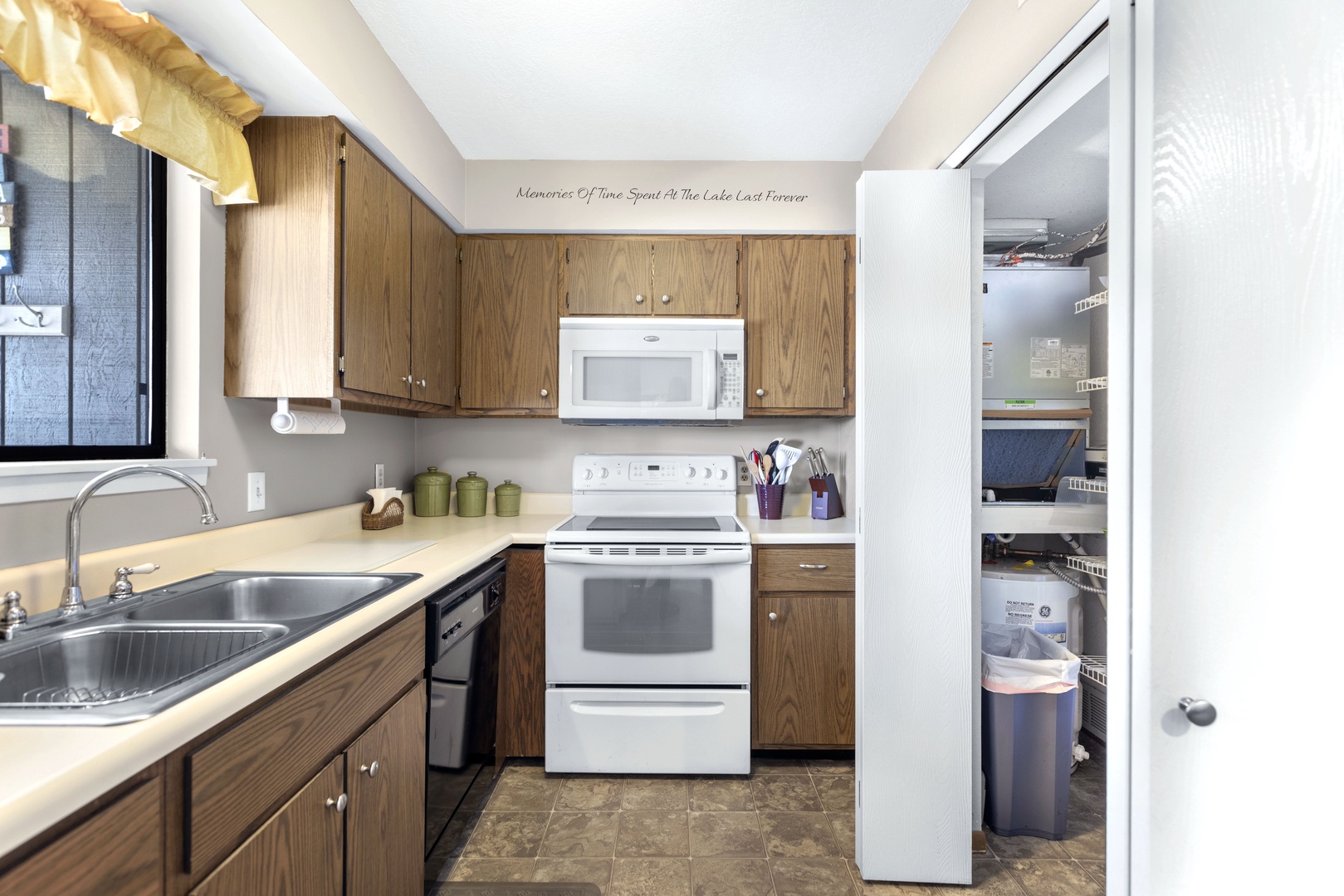 This charming kitchen provides plenty of space and all the comforts of home