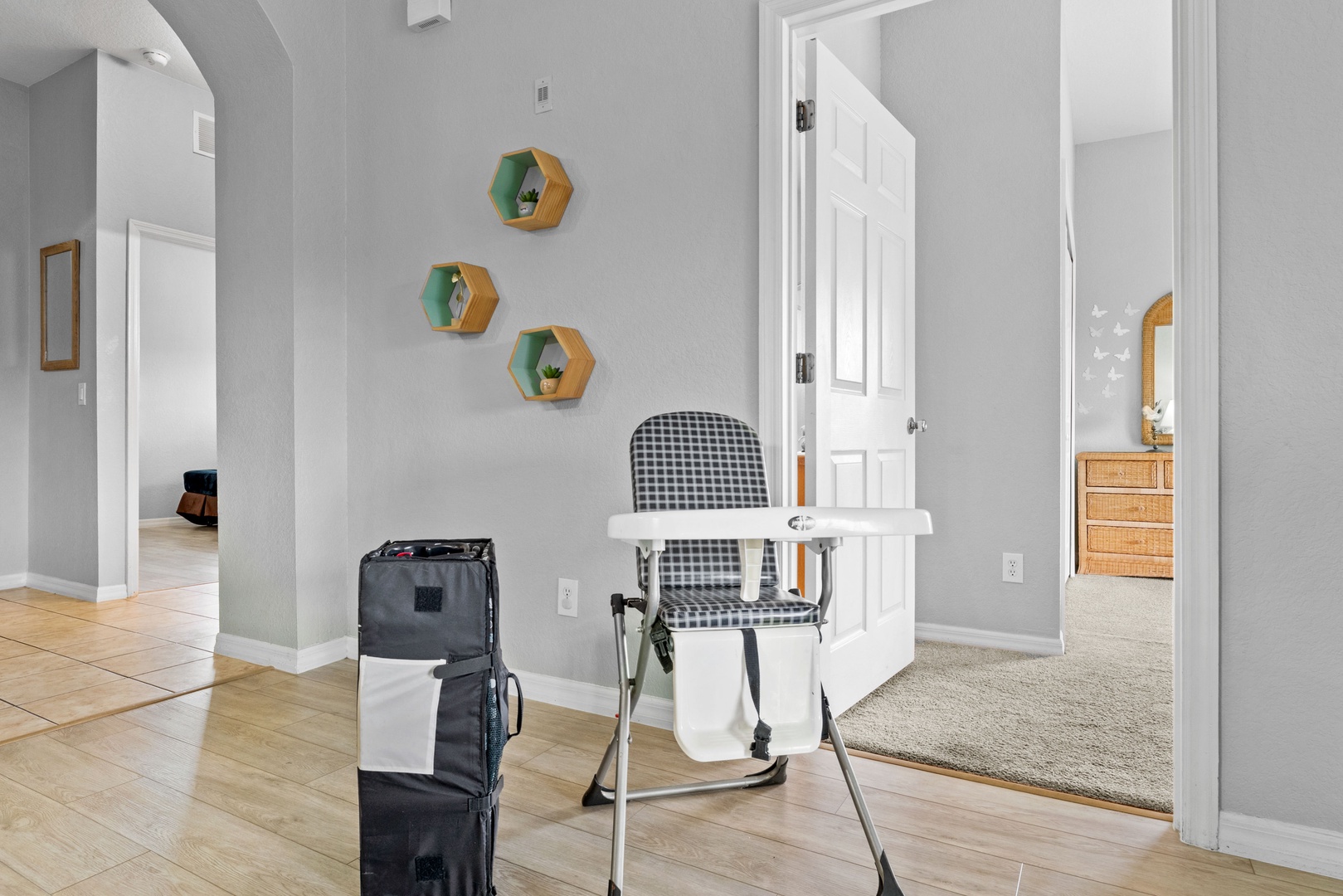 Hallway with highchair available for use during your stay