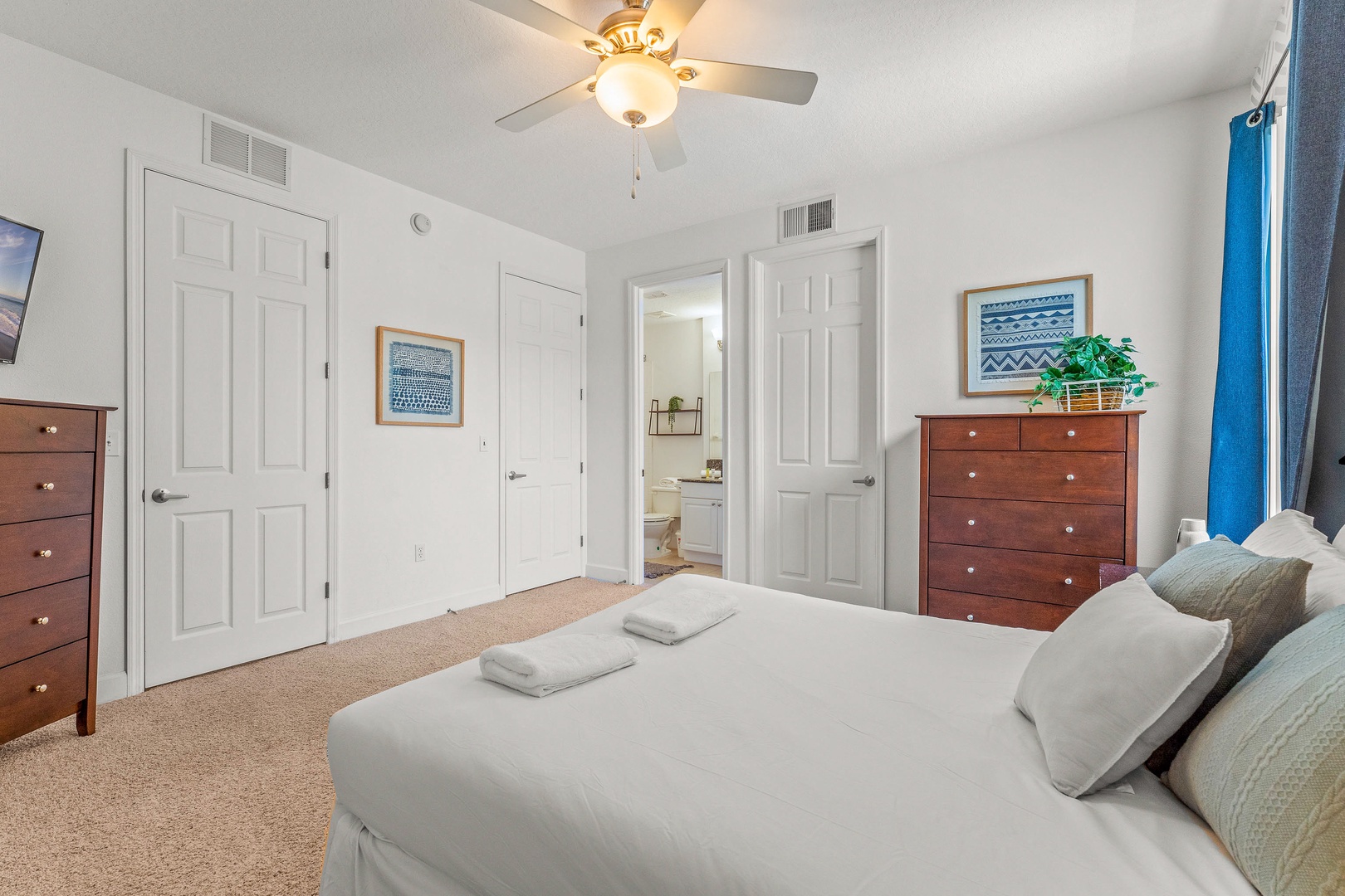 Relax in a serene king bedroom with ensuite bathroom & ceiling fan