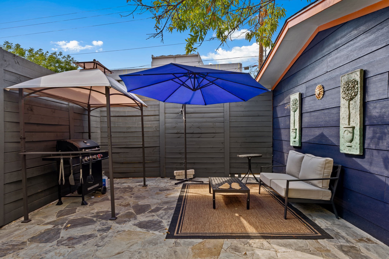 Patio with hot tub, BBQ, and seating area (Unit B)