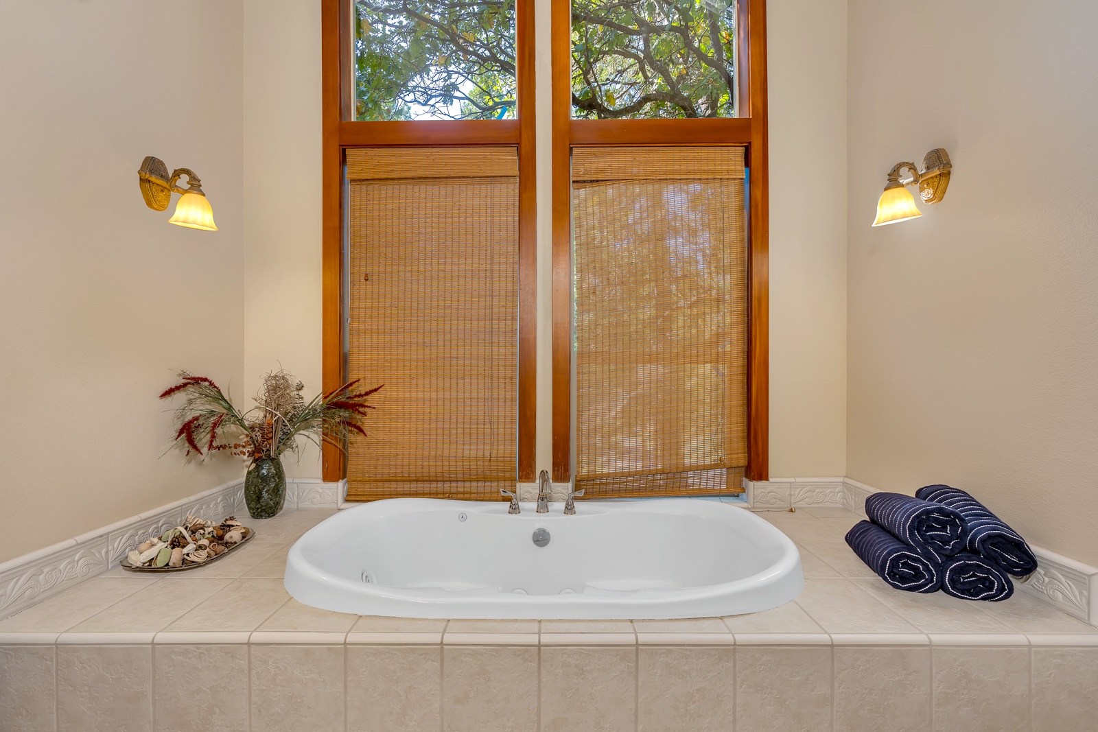 The king en suite boasts a double vanity, walk-in shower, & jetted soaking tub
