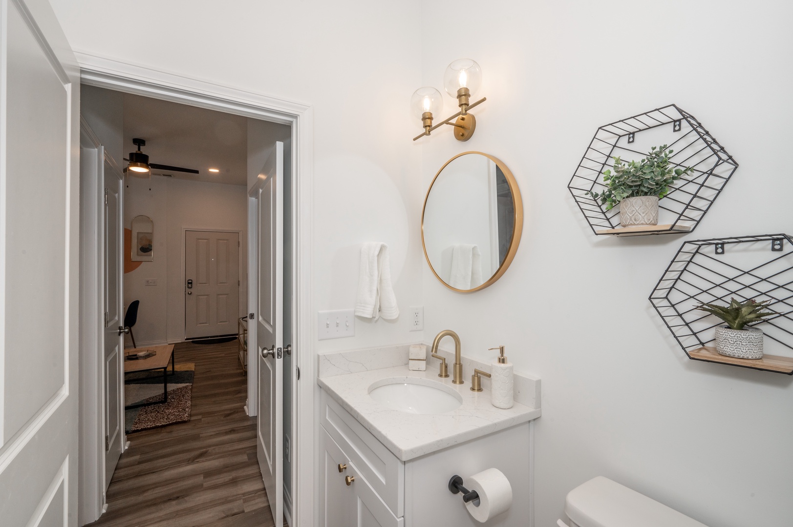 Unit 202: The bathroom offers a chic single vanity and luxurious glass shower