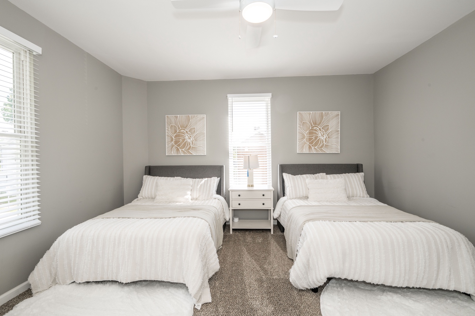 The final 2nd floor bedroom offers a pair of full-sized beds & vanity/desk space