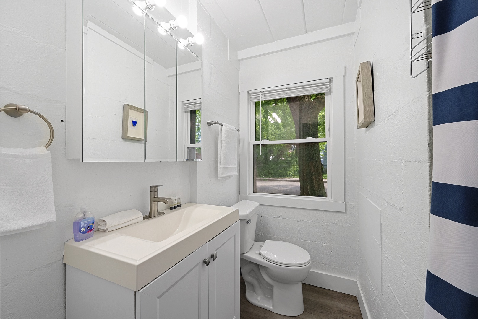 A single vanity & shower await in the serene full bathroom