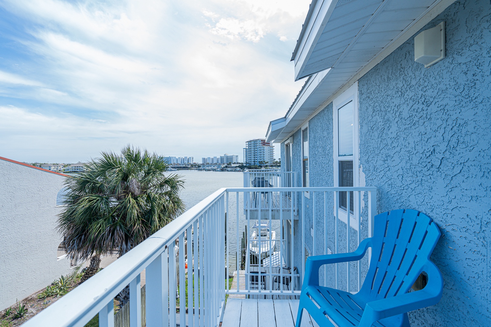 Step out onto the 3rd-floor balcony & take in the fresh air with water views
