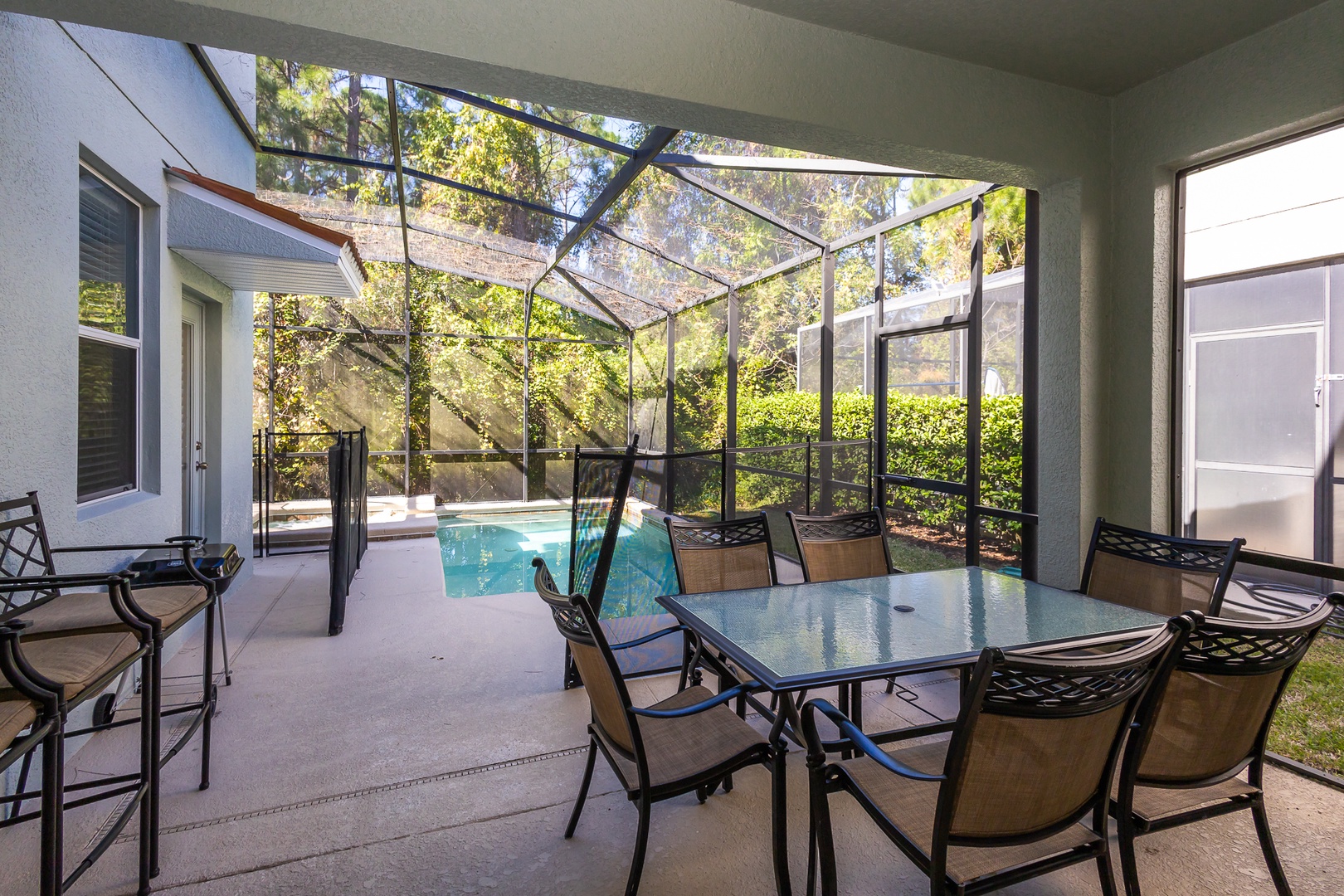 Enjoy al fresco dining before an evening dip in your own lanai-covered pool