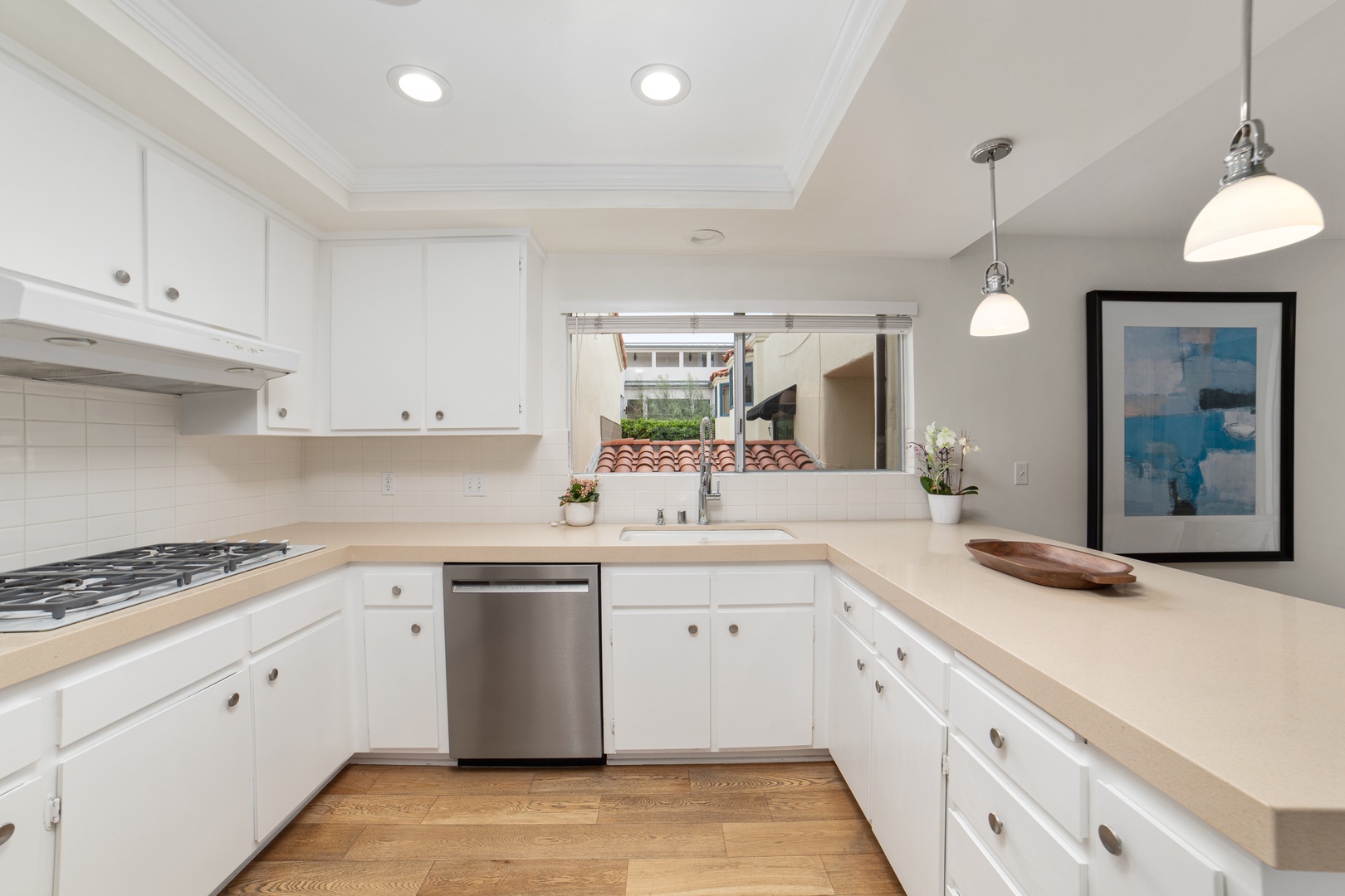 The open, airy kitchen offers ample space & every home comfort