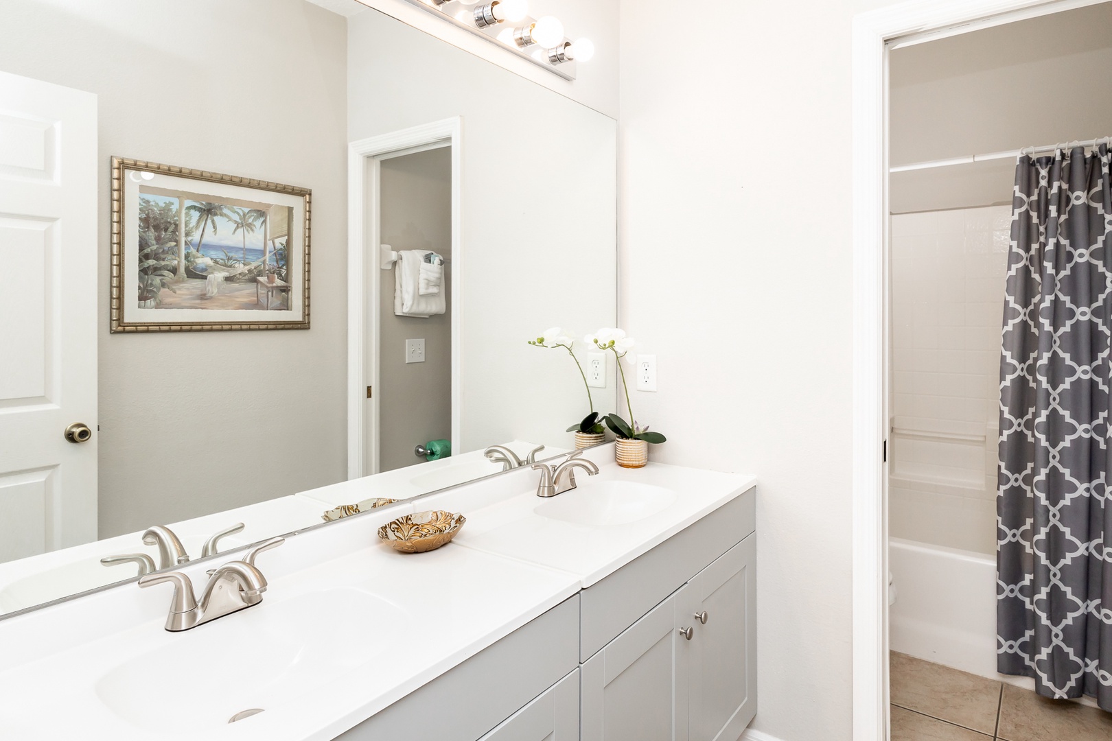 The first full bath offers dual vanities & a shower/tub combo