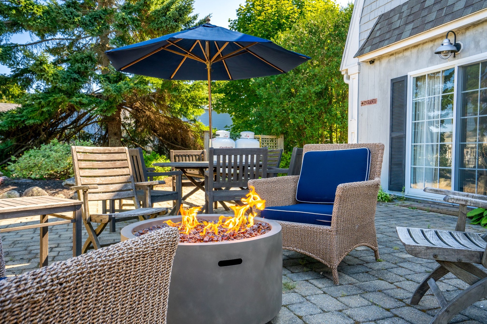 Inviting front patio with cozy fire pit for relaxation