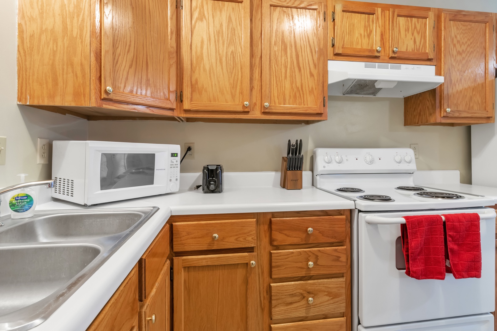 The cozy kitchen offers ample space & all the comforts of home
