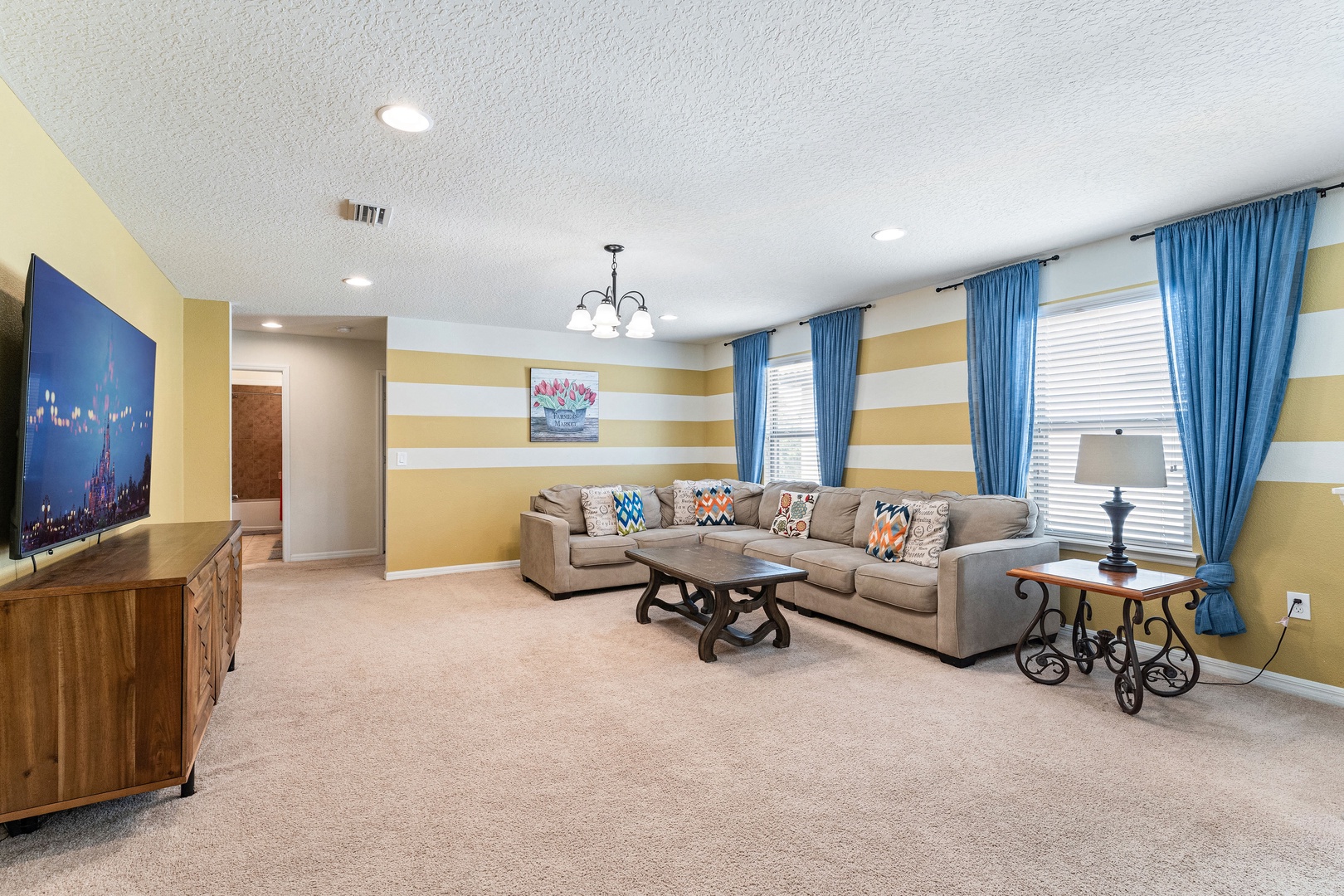 2nd floor living space with sectional sofa and Smart TV