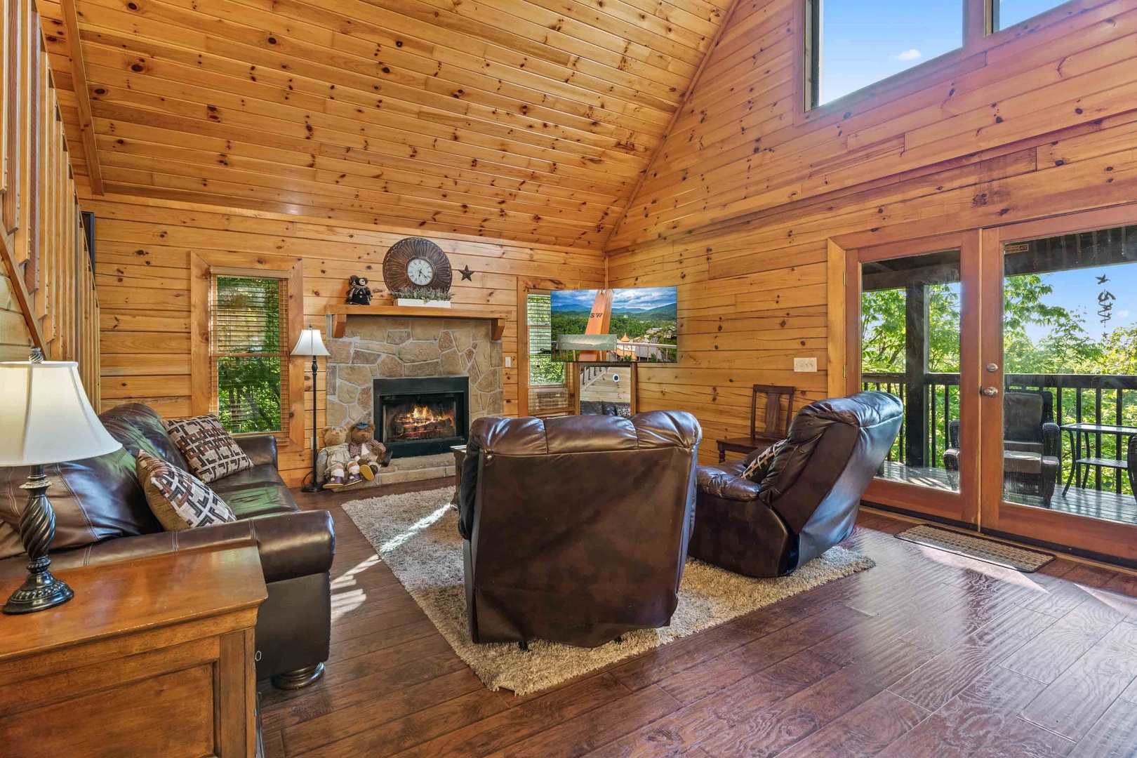 Living area with ample seating, Smart TV, and fireplace