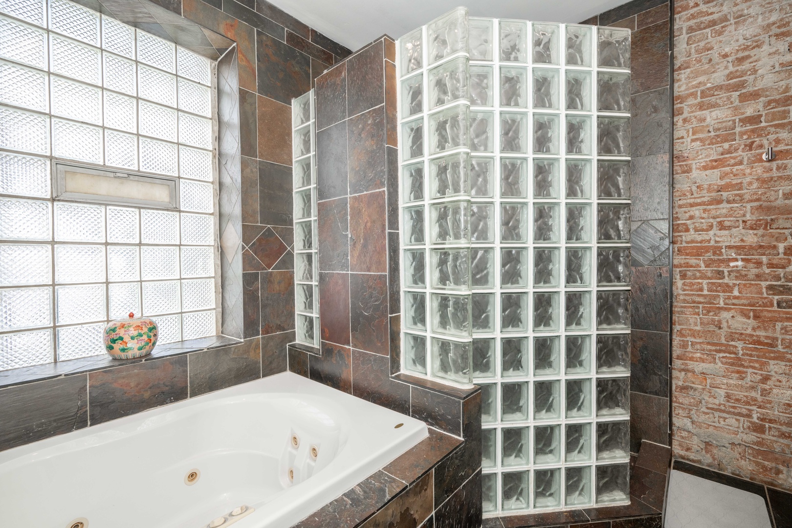 Indulge in the master bath's jetted tub, walk-in shower, & large double vanity