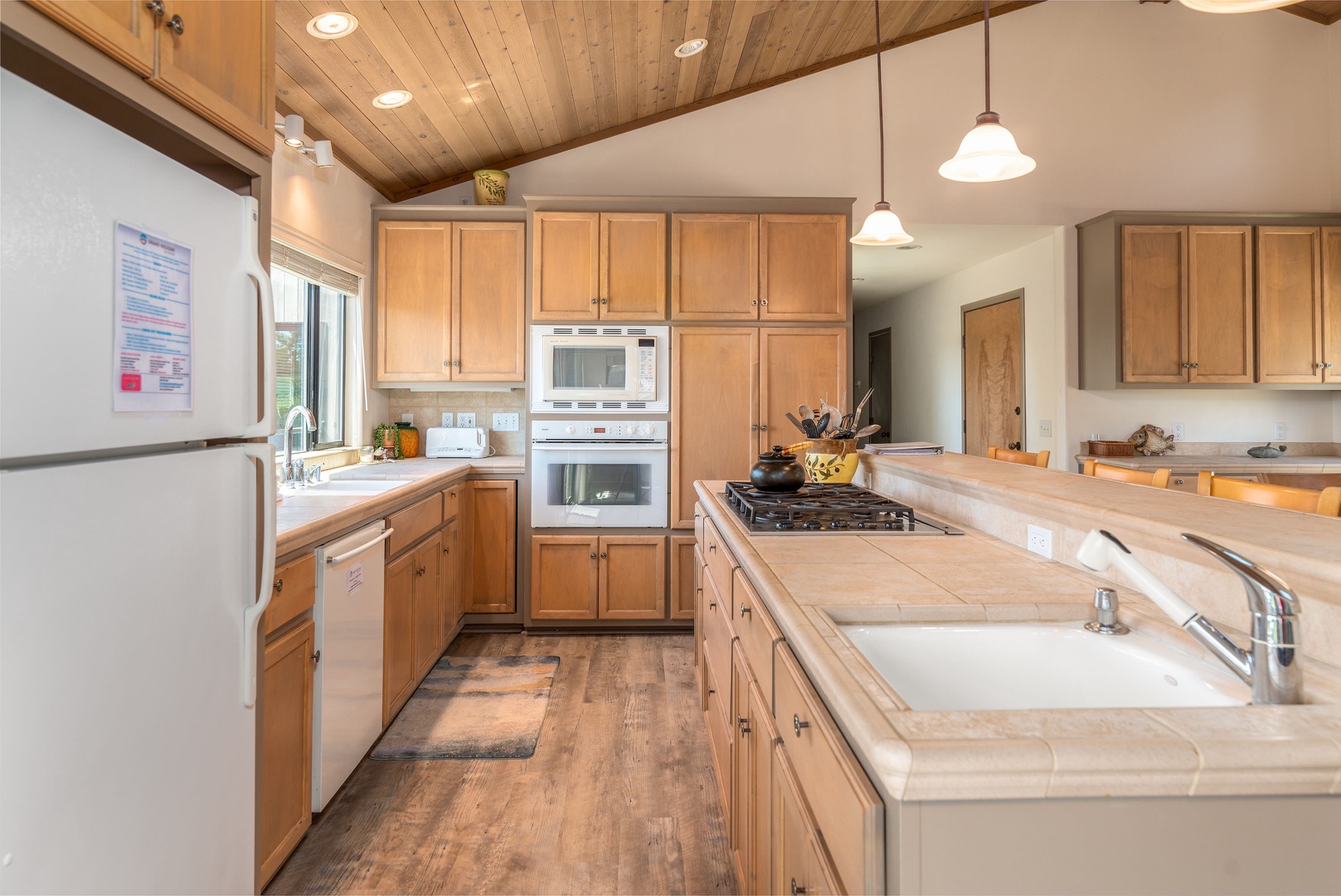 Kitchen with toaster, microwave, dishwasher and more