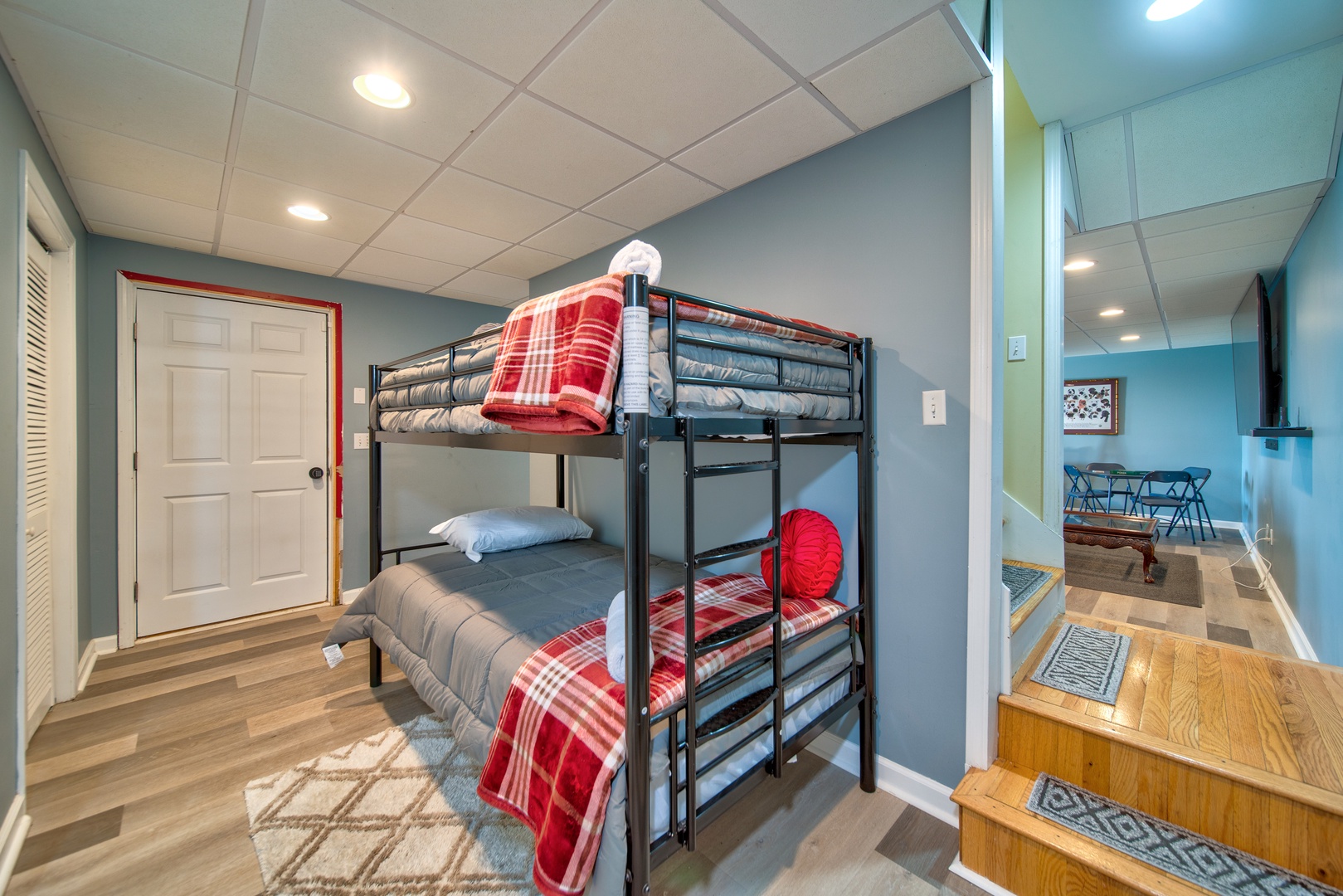 A twin-over-twin bunkbed awaits on the lower level