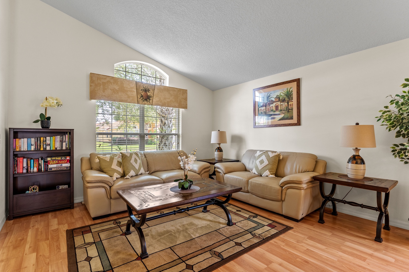Front living room with a full-size sleeper sofa and dining area for 6