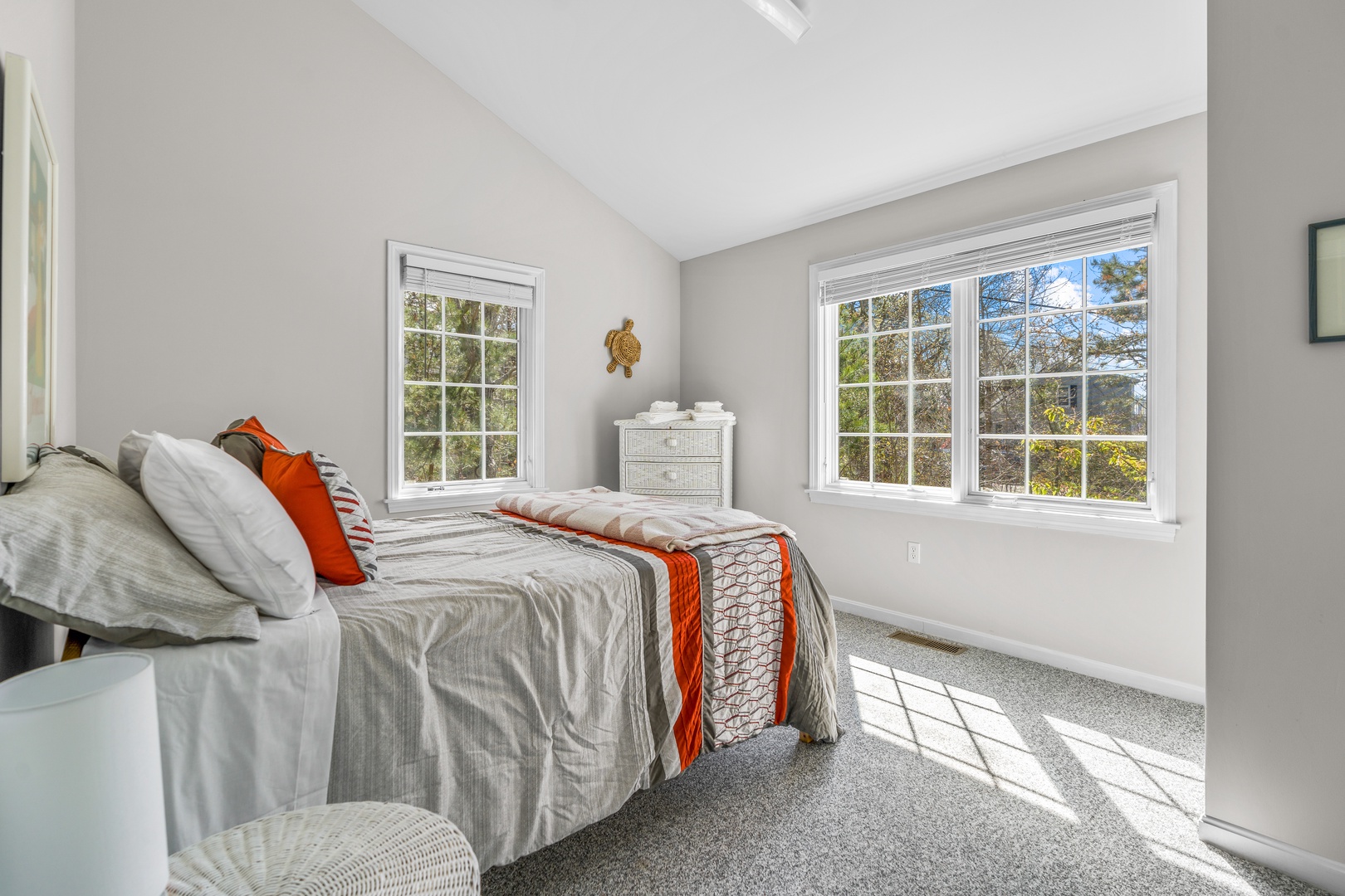 The second bedroom retreat includes a comfy full-sized bed & water views