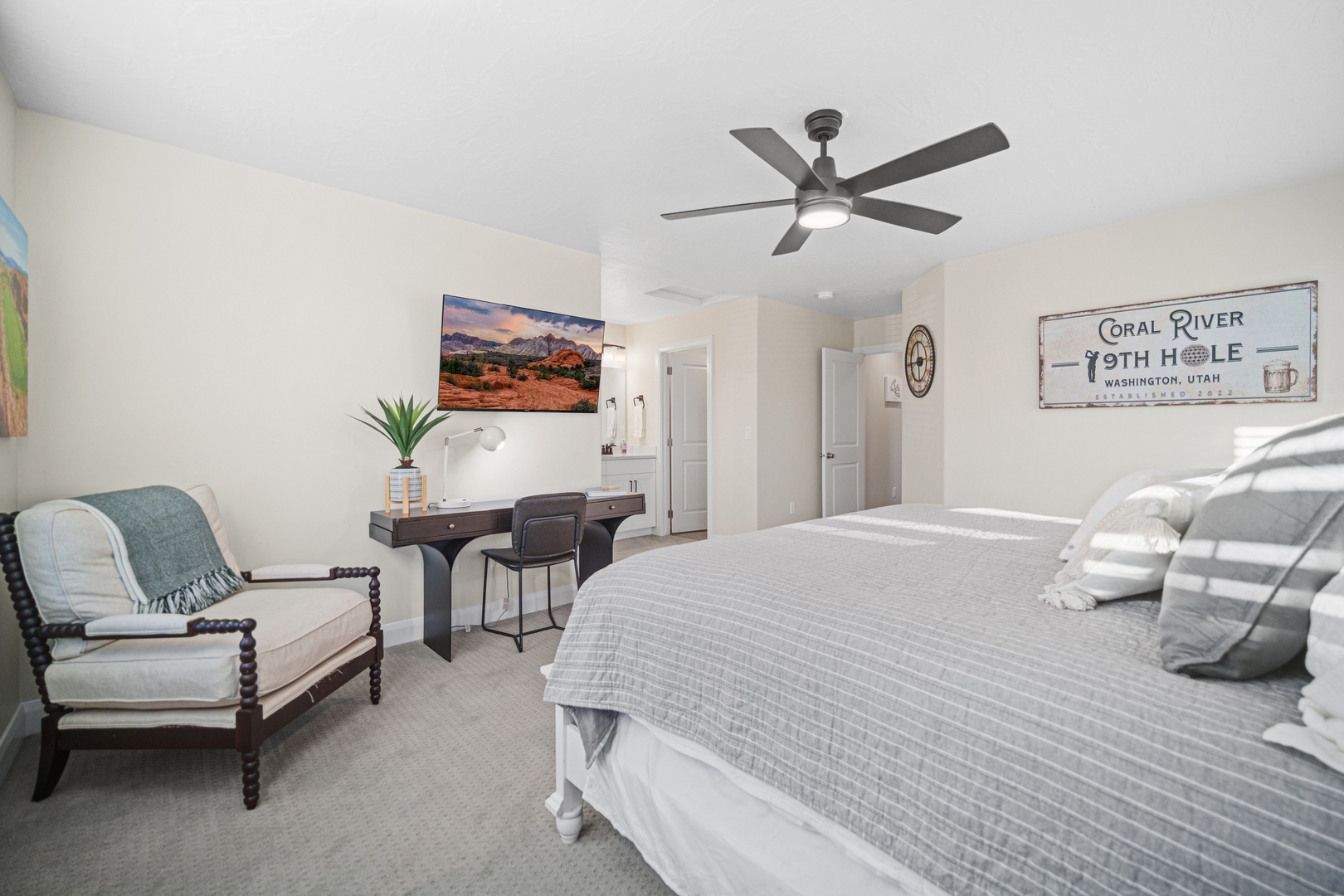 Bedroom 1 with king bed, workspace, Smart TV, and ensuite