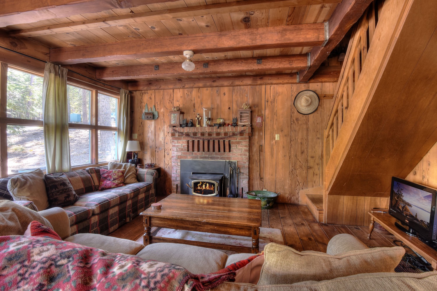Living room with wood burning fireplace, Smart TV (Netflix, Hulu, etc.)