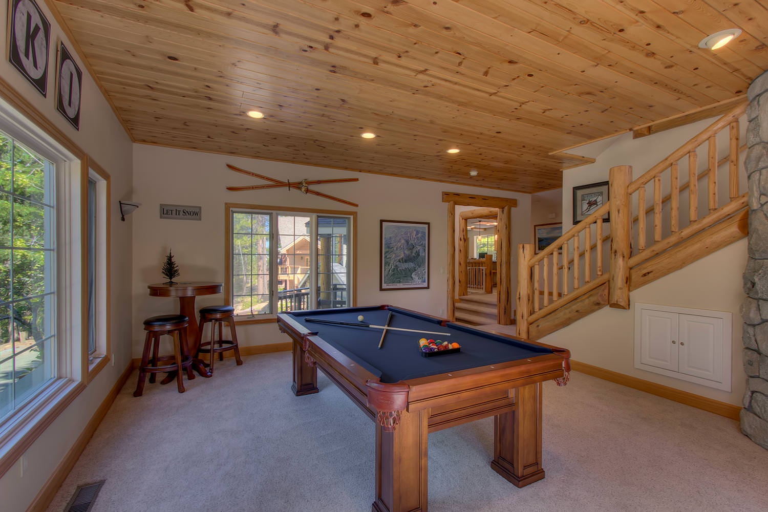 Downstairs game room with pool table and Smart TV