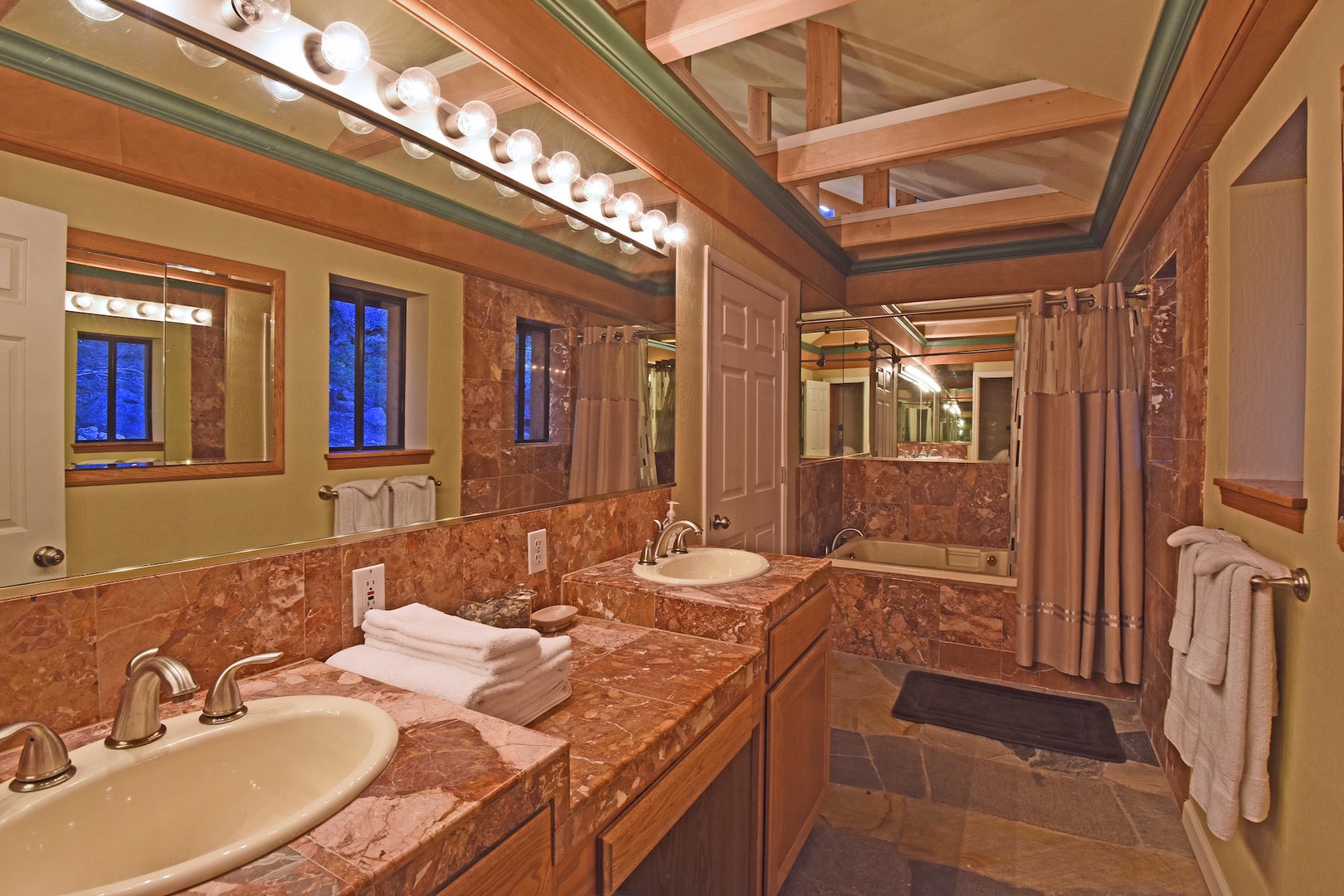 En suite master bathroom with dual sinks