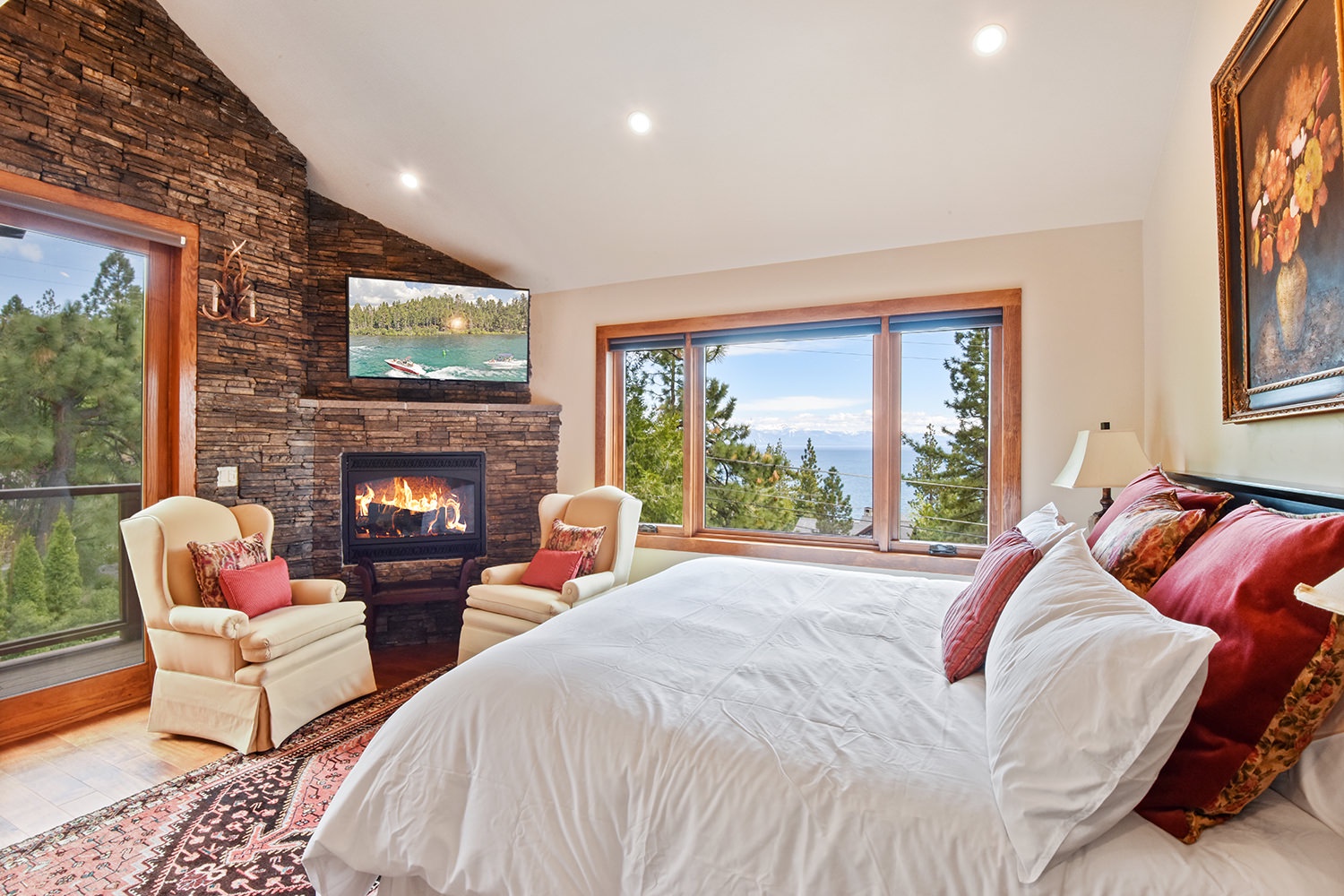 3rd floor master bedroom: King bed with lake view, Smart TV, private balcony and gas fireplace