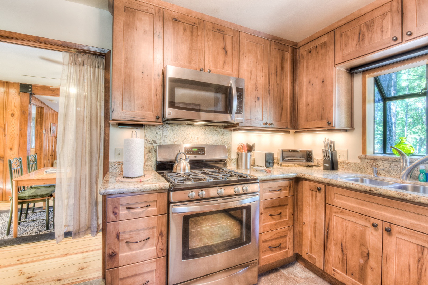 Full kitchen w/ modern appliances: toaster, crockpot, drip coffee maker, wine ware, spices, foil, and much more!