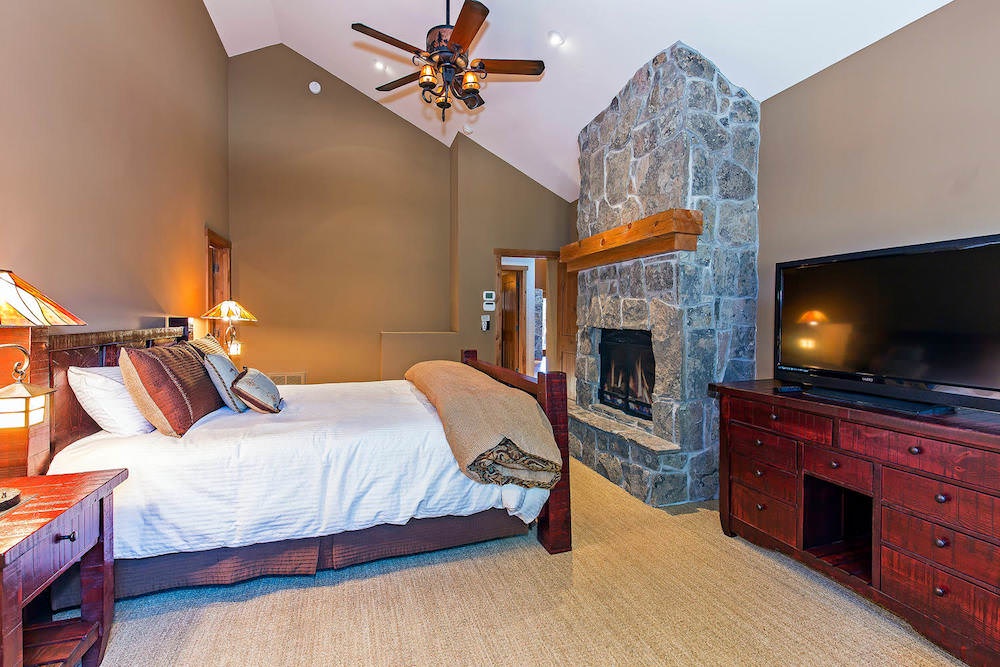Master bedroom: King bed w/ fireplace and TV