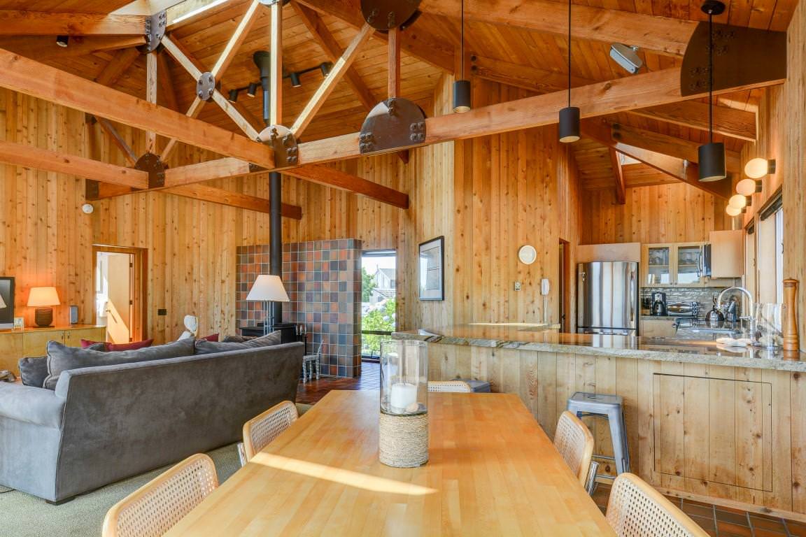 Open dining area looking into living room and kitchen in modern rustic decor
