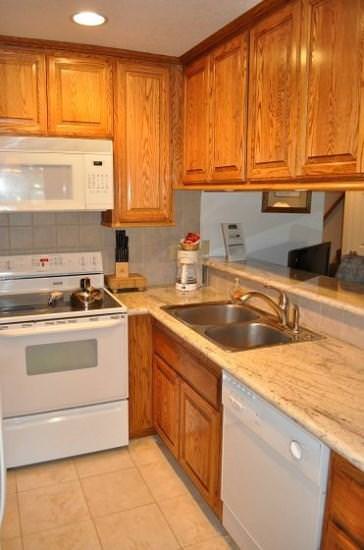 Kitchen w/ toaster oven, drip coffee pot, blender, pots/pans and more