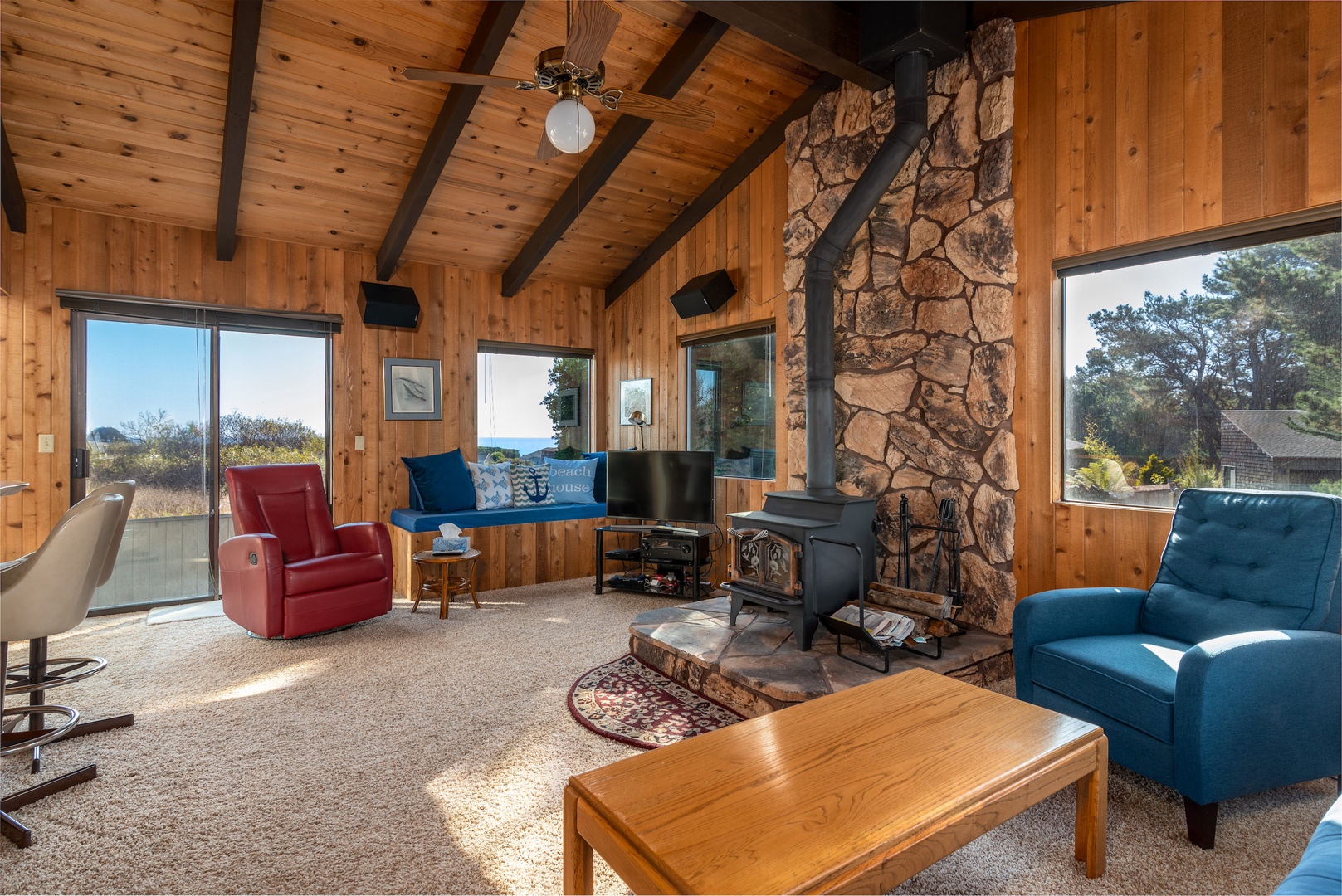 Cozy living room with wood stove fireplace & TV