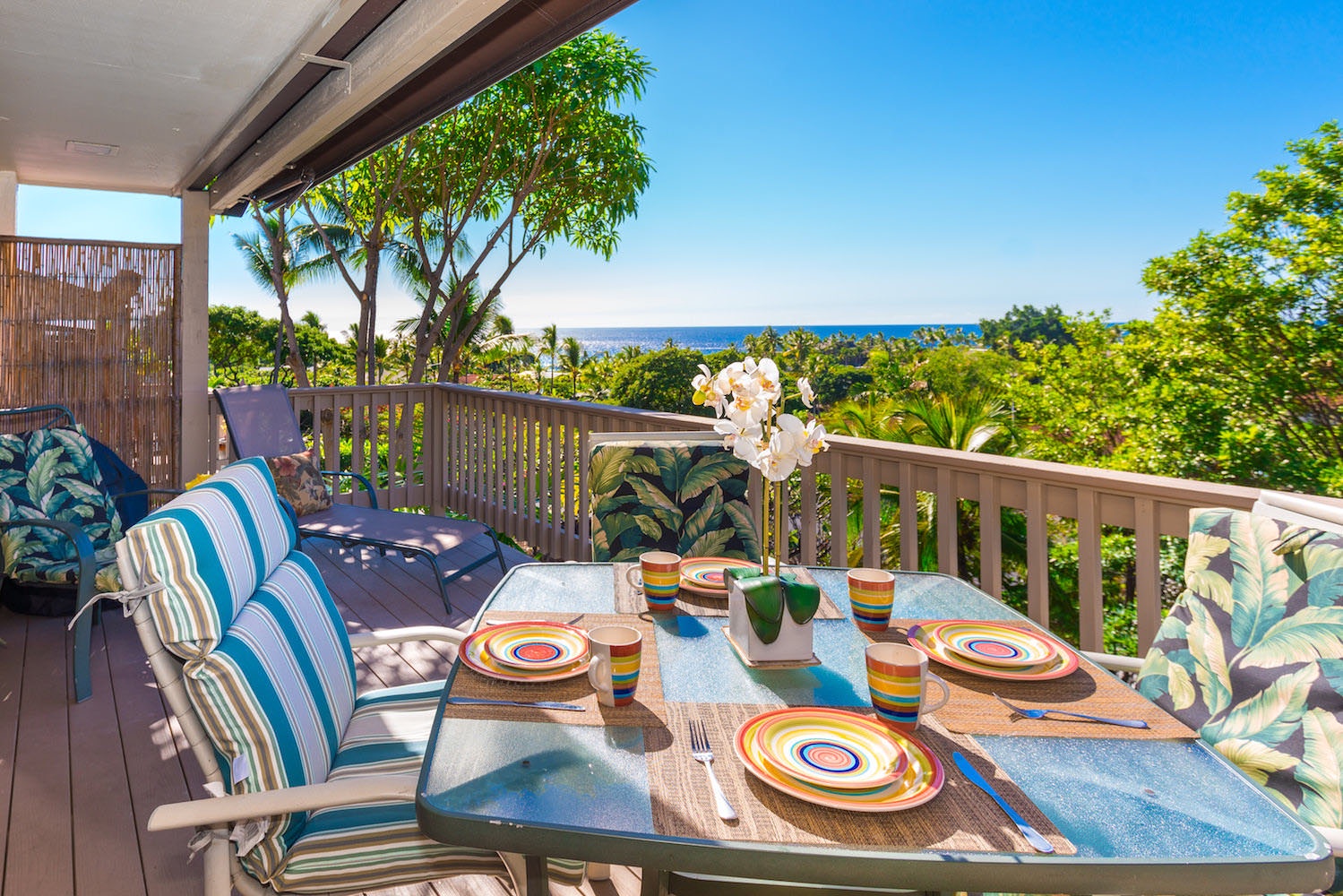 Enjoy quiet outdoor dining with partial ocean views on your private lanai